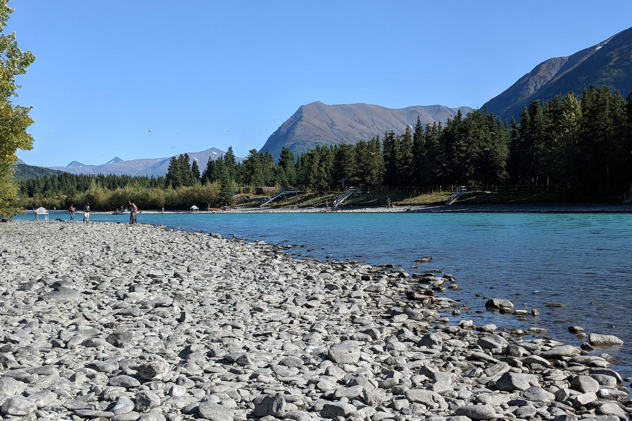 Anglers gather along the banks of the Kenai River near Sportsman’s Landing in Cooper Landing in September 2018. (Peninsula Clarion file)