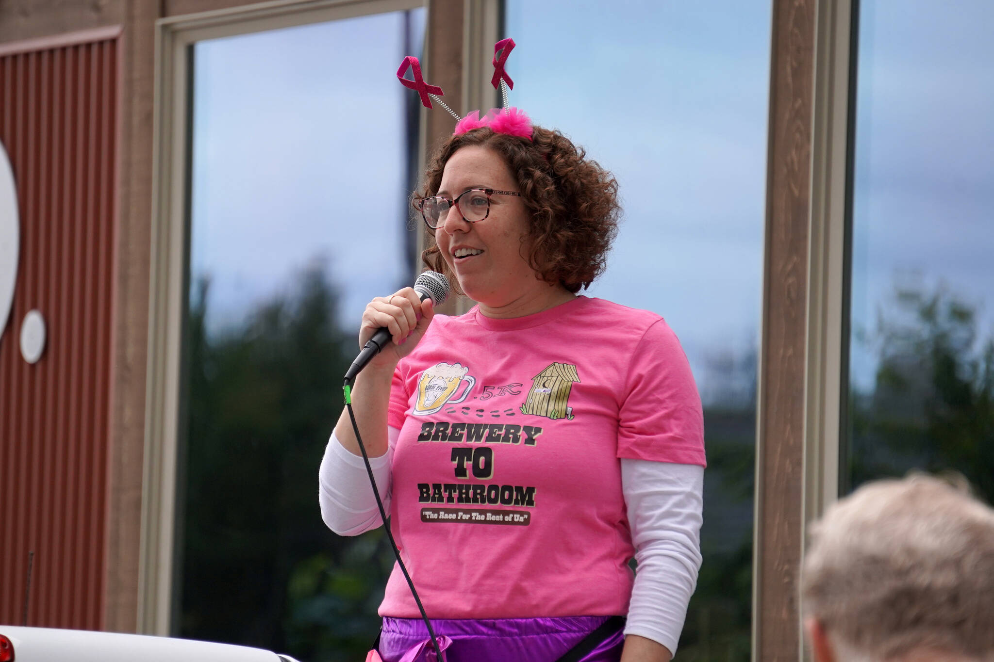 Alana Martin speaks before the start of the Brewery to Bathroom .5K at Kenai River Brewing in Soldotna, Alaska, on Sunday, Aug. 13, 2023. (Jake Dye/Peninsula Clarion)