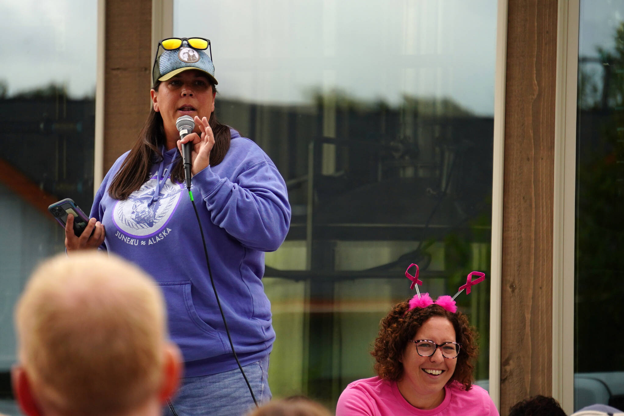 Nicole Murphy and Alana Martin speak before the start of the Brewery to Bathroom .5K at Kenai River Brewing in Soldotna, Alaska, on Sunday, Aug. 13, 2023. (Jake Dye/Peninsula Clarion)