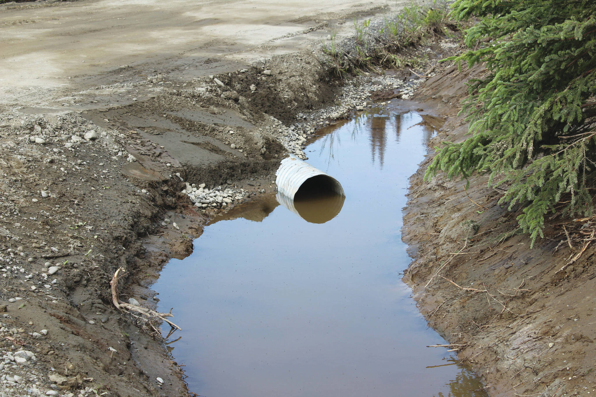 A newly installed culvert moves water at the intersection of Patrick Drive and Bjerke Street on Monday, July 24, 2023, near Kenai, Alaska. (Ashlyn O’Hara/Peninsula Clarion)