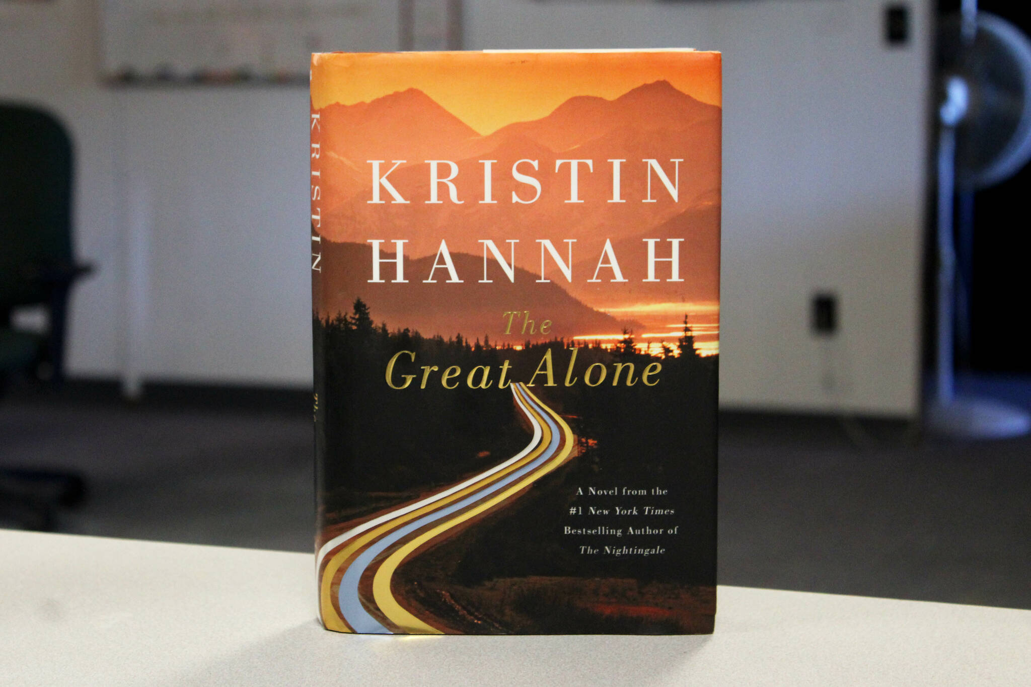 A copy of “The Great Alone” sits on a desk in the Peninsula Clarion offices on Thursday, Aug. 17, 2023, in Kenai, Alaska. (Ashlyn O’Hara/Peninsula Clarion)