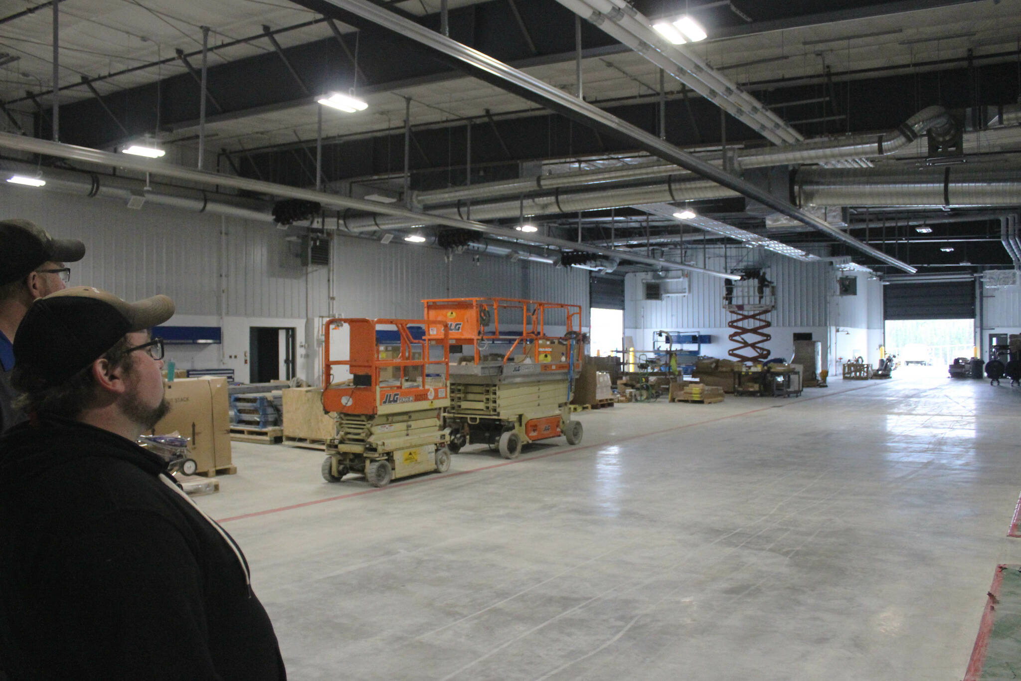 From left: Kendall Kenai Peninsula Service Manager Joshua Lee and Project Manager Vincent English stand near service bays in Kendall’s new service facility and dealership on Wednesday, Aug. 16, 2023, in Soldotna, Alaska. (Ashlyn O’Hara/Peninsula Clarion)