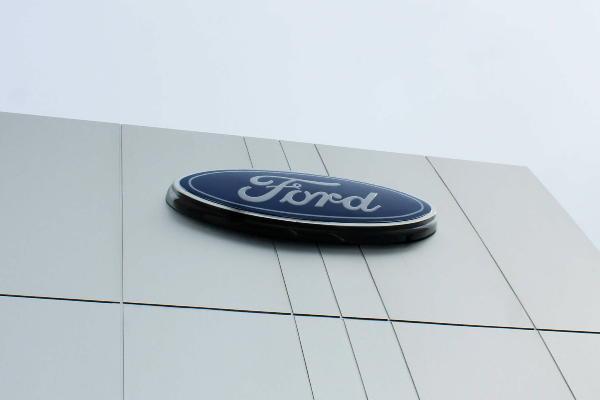 The Ford logo overlooks the Sterling Highway from Kendall’s new service facility and dealership on Wednesday, Aug. 17, 2023, in Soldotna, Alaska. (Ashlyn O’Hara/Peninsula Clarion)