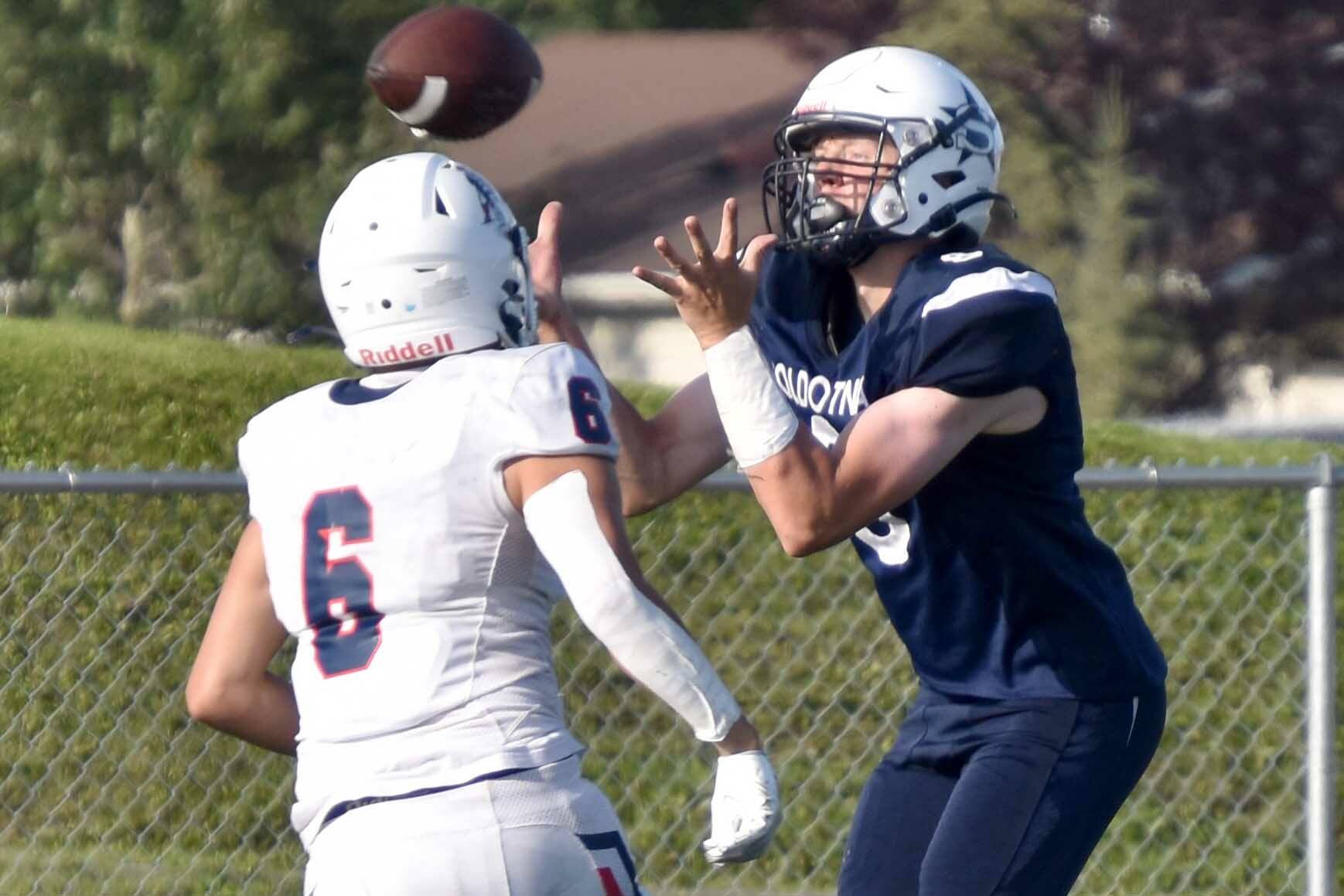 Soldotna's Andrew Pieh catches a pass in front of North Pole's Korbin Wallace on Friday, Aug. 18, 2023, at Justin Maile Field at Soldotna High School in Soldotna, Alaska. (Photo by Jeff Helminiak/Peninsula Clarion)