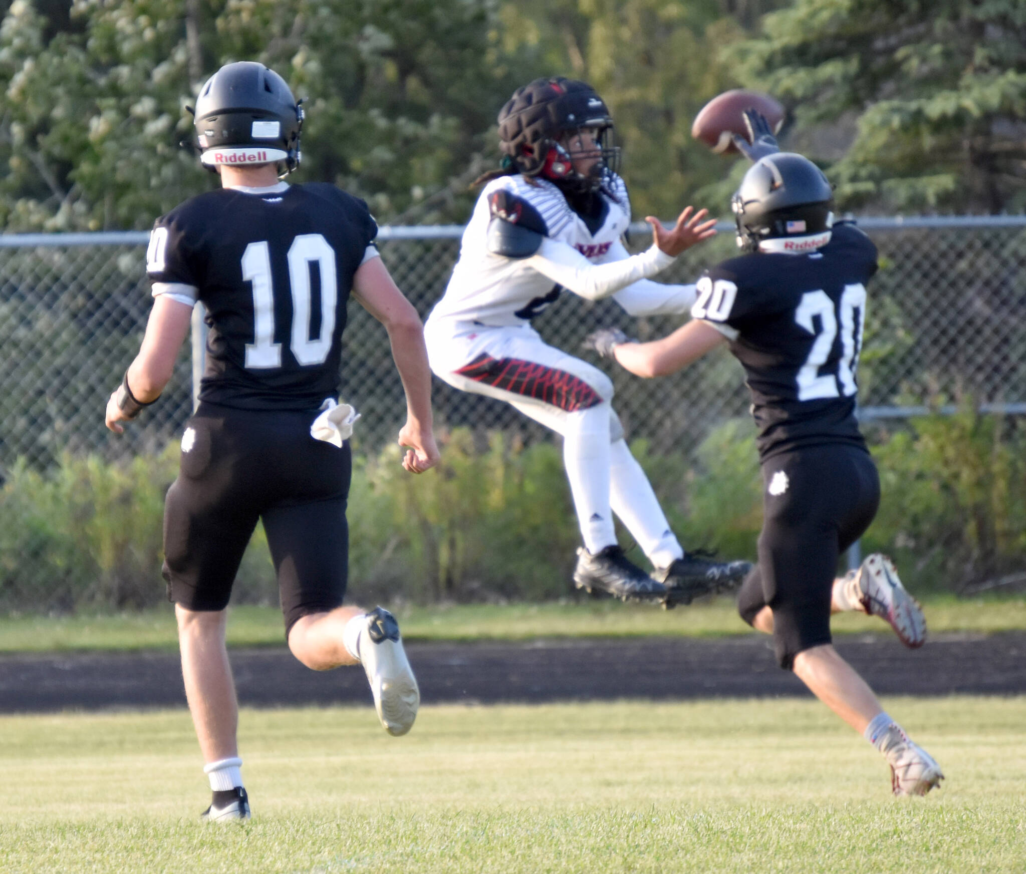 Eielson’s Mitchell Drayton gets behind Nikiski’s Wyatt Maguire for a touchdown catch Saturday, Aug. 19, 2023, at Nikiski Middle-High School in Nikiski, Alaska. (Photo by Jeff Helminiak/Peninsula Clarion)