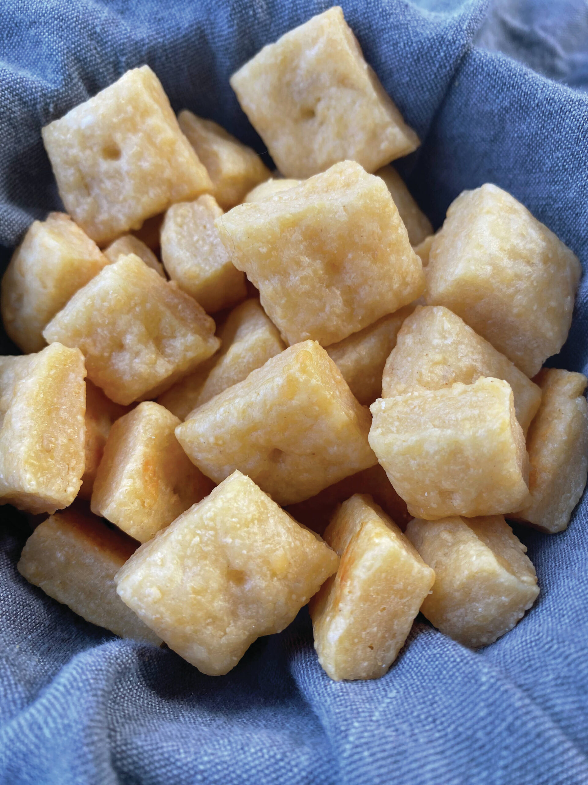 These cheesy crackers are easy to make at home and come without the dyes or preservatives of a store-bought brand. (Photo by Tressa Dale/Peninsula Clarion)