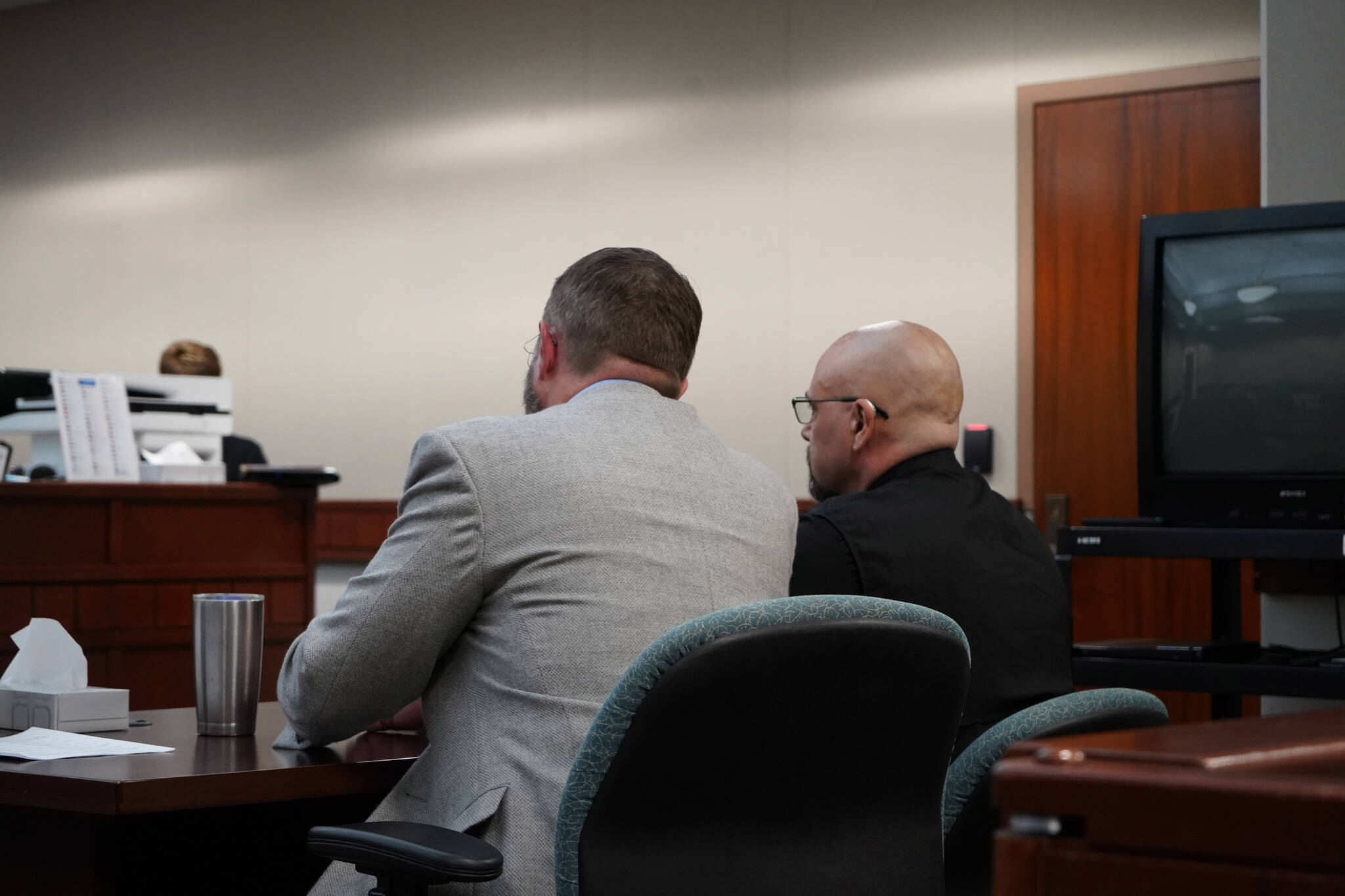 Soldotna Police Officer David Bower, right, sits with his lawyer, Andy Pevehouse, during a bail hearing at the Kenai Courthouse in Kenai, Alaska, on Aug. 16, 2023. (Jake Dye/Peninsula Clarion)