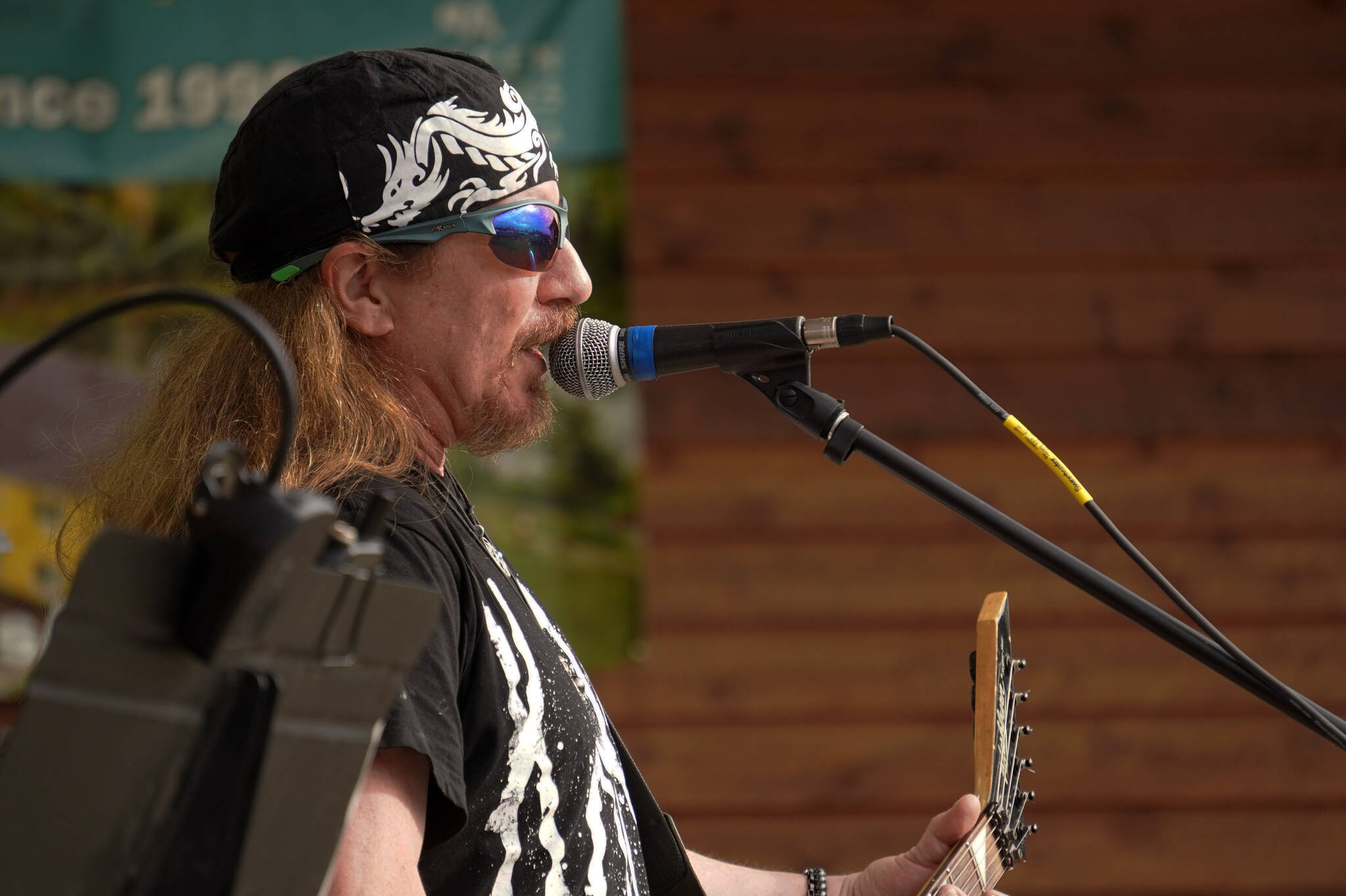 Scott Warner performs as part of Hot Mess at Soldotna Creek Park in Soldotna, Alaska, on Wednesday, Aug. 23, 2023. (Jake Dye/Peninsula Clarion)