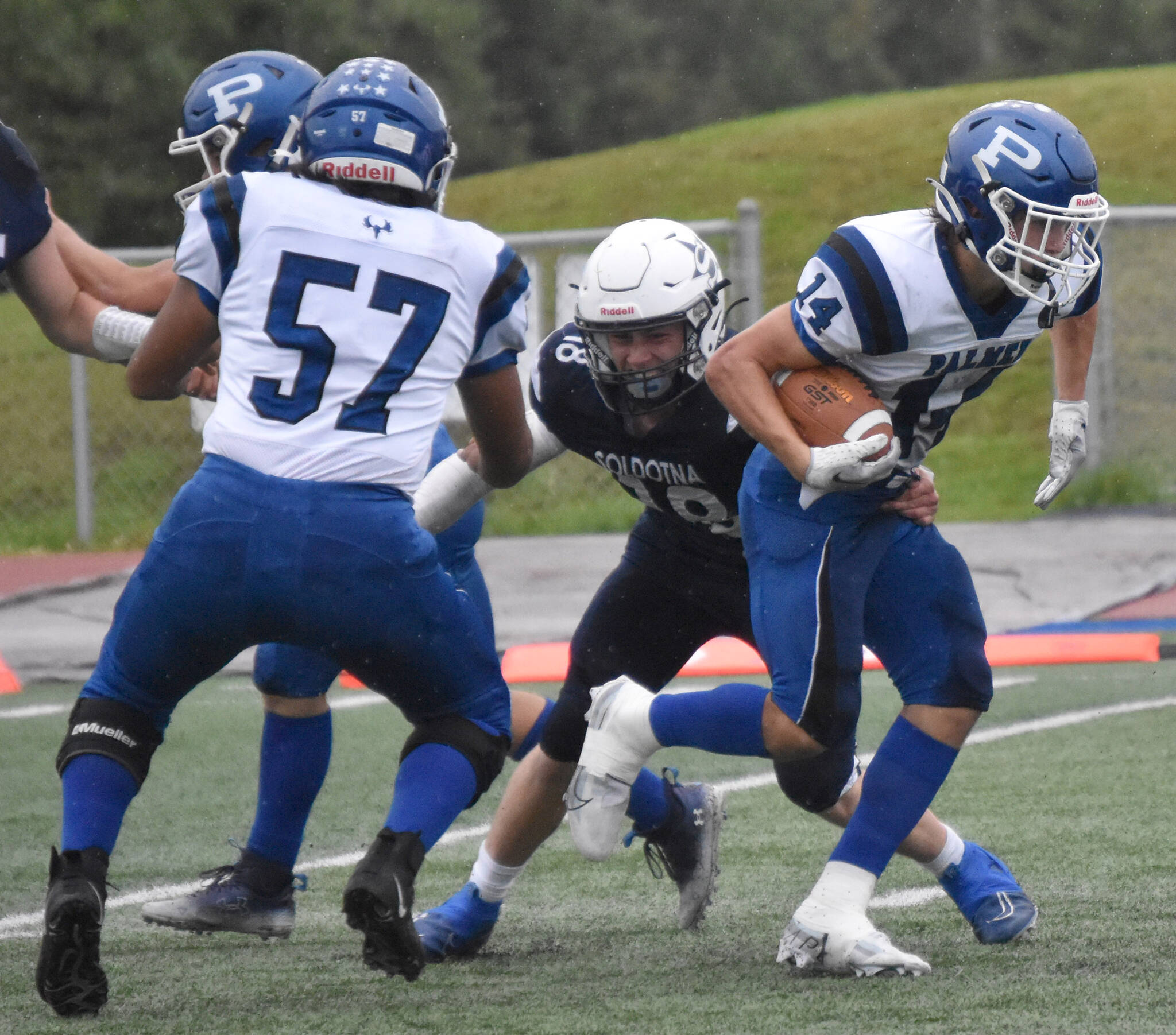 Soldotna’s Collin Peck makes the tackle on Palmer’s Reed Craner on Friday, Aug. 25, 2023, at Justin Maile Field at Soldotna High School in Soldotna, Alaska. (Photo by Jeff Helminiak/Peninsula Clarion)