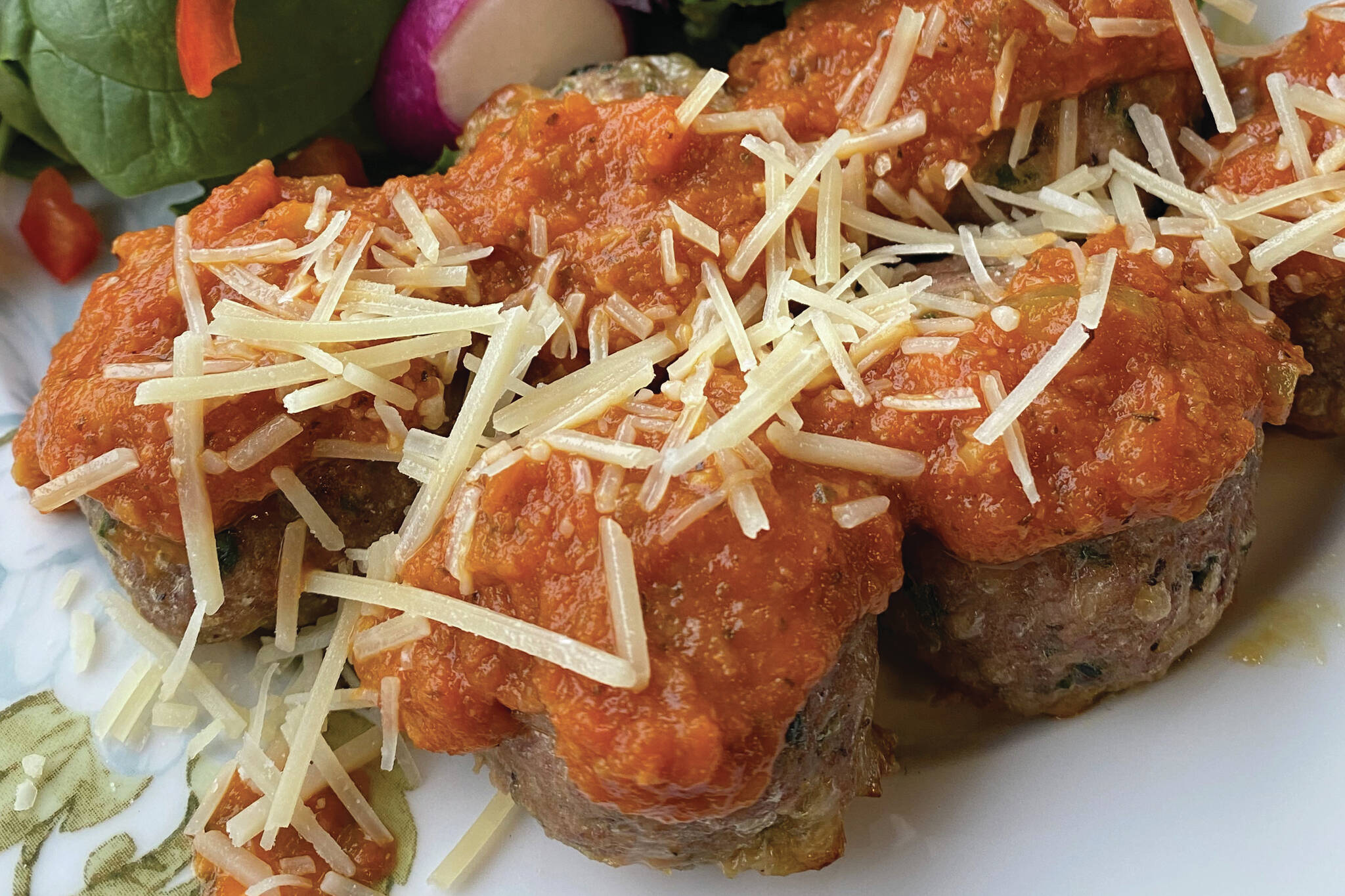 Slow spaghetti sauce and turkey meatballs are loaded with enough cheese and herbs to change your mind about ground turkey. (Photo by Tressa Dale/Peninsula Clarion)