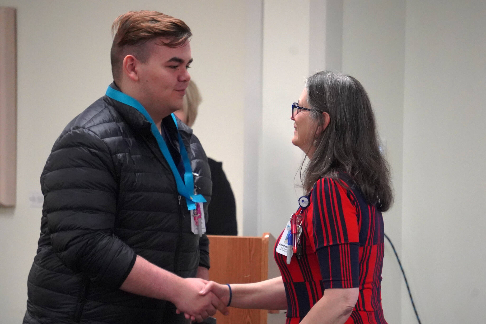 Kenneth Coghill II receives a certified nurse assistant pin from Ana Monyahan at a CNA graduation ceremony at Central Peninsula Hospital in Soldotna, Alaska, on Friday, Aug. 25, 2023. (Jake Dye/Peninsula Clarion)