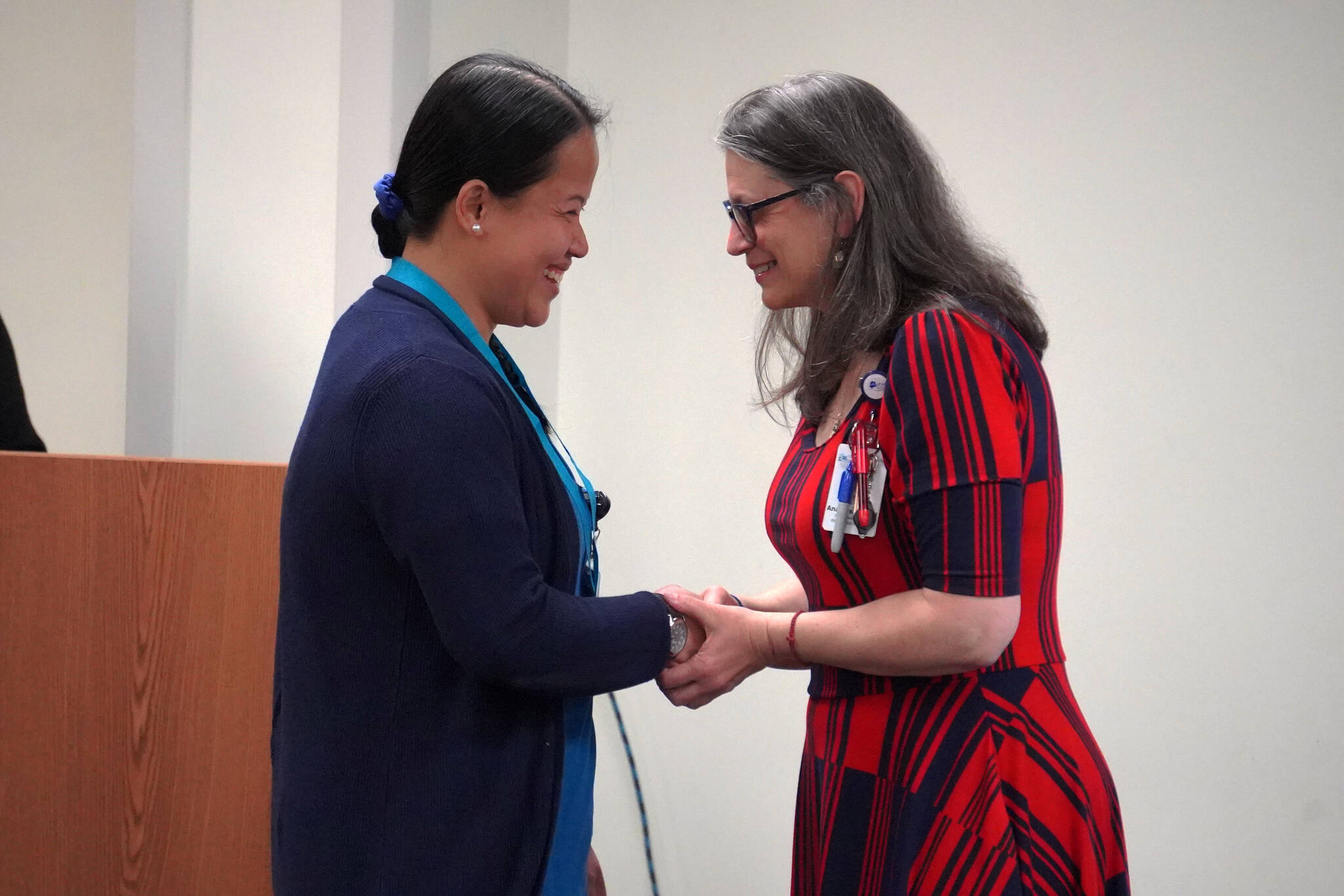 Josie Sudario receives a certified nurse assistant pin from Ana Monyahan at a CNA graduation ceremony at Central Peninsula Hospital in Soldotna, Alaska, on Friday, Aug. 25, 2023. (Jake Dye/Peninsula Clarion)