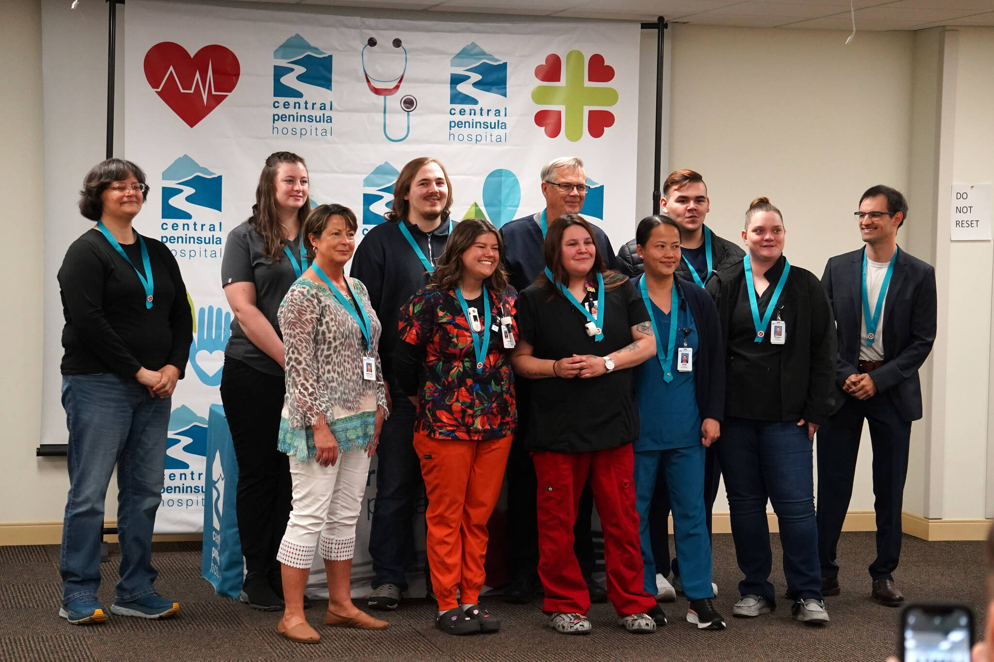 Certified Nurse Assistant program graduates stand for a photo at Central Peninsula Hospital in Soldotna, Alaska, on Friday, Aug. 25, 2023. (Jake Dye/Peninsula Clarion)