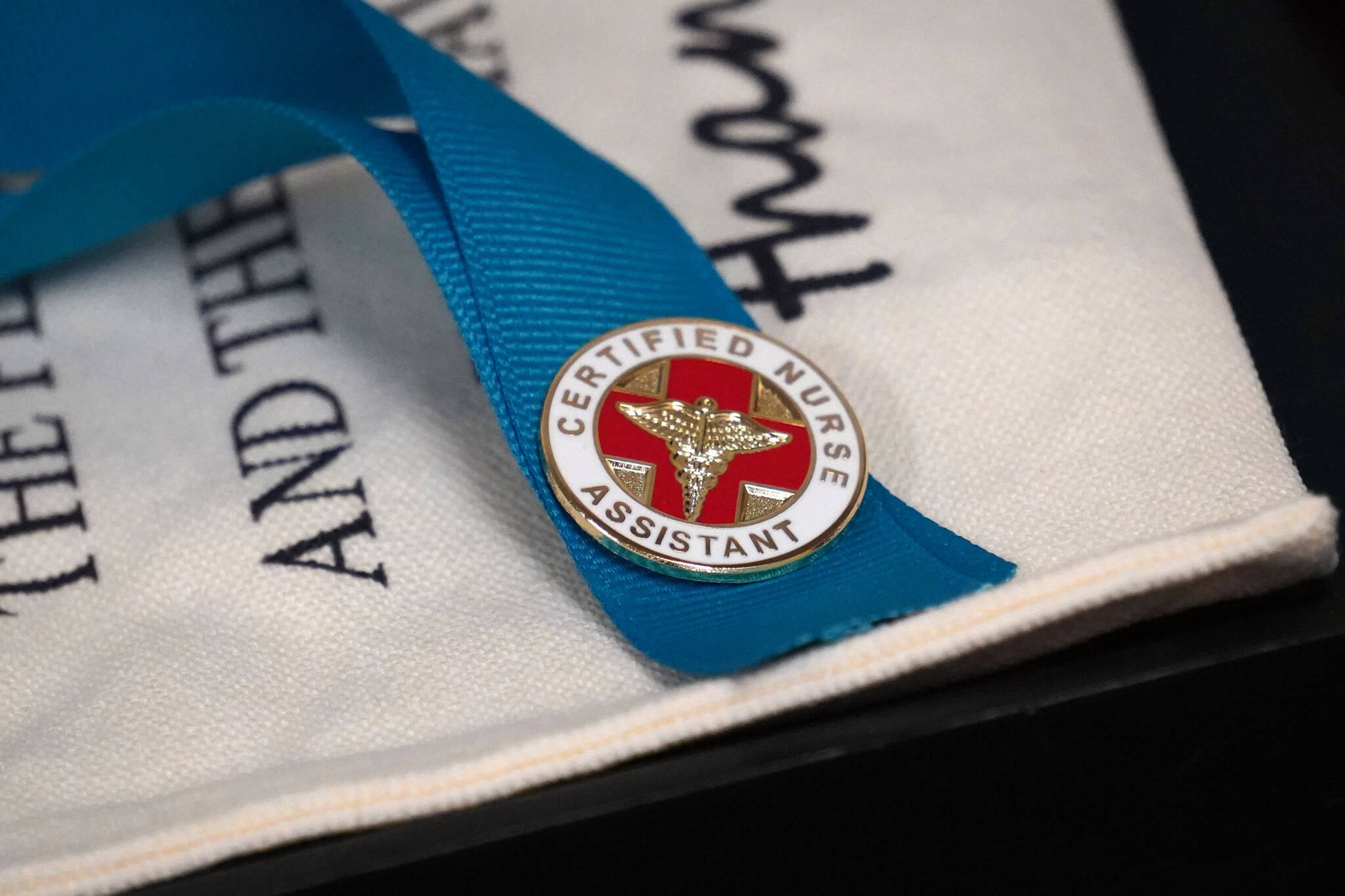 A Certified Nurse Assistant pin is seen at Central Peninsula Hospital in Soldotna, Alaska, on Friday, Aug. 25, 2023. (Jake Dye/Peninsula Clarion)