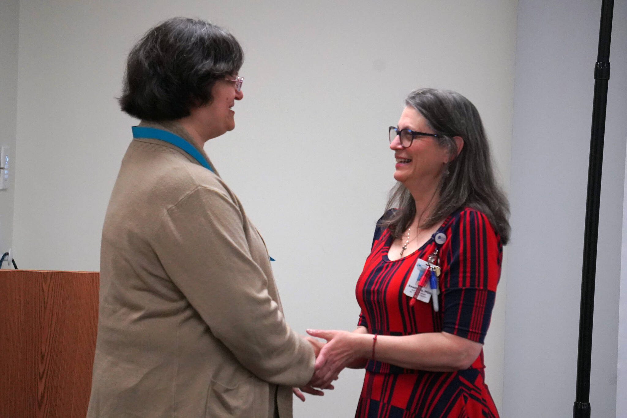 Monica Partida Bravo Moe receives a certified nurse assistant pin from Ana Monyahan at a CNA graduation ceremony at Central Peninsula Hospital in Soldotna, Alaska, on Friday, Aug. 25, 2023. (Jake Dye/Peninsula Clarion)
