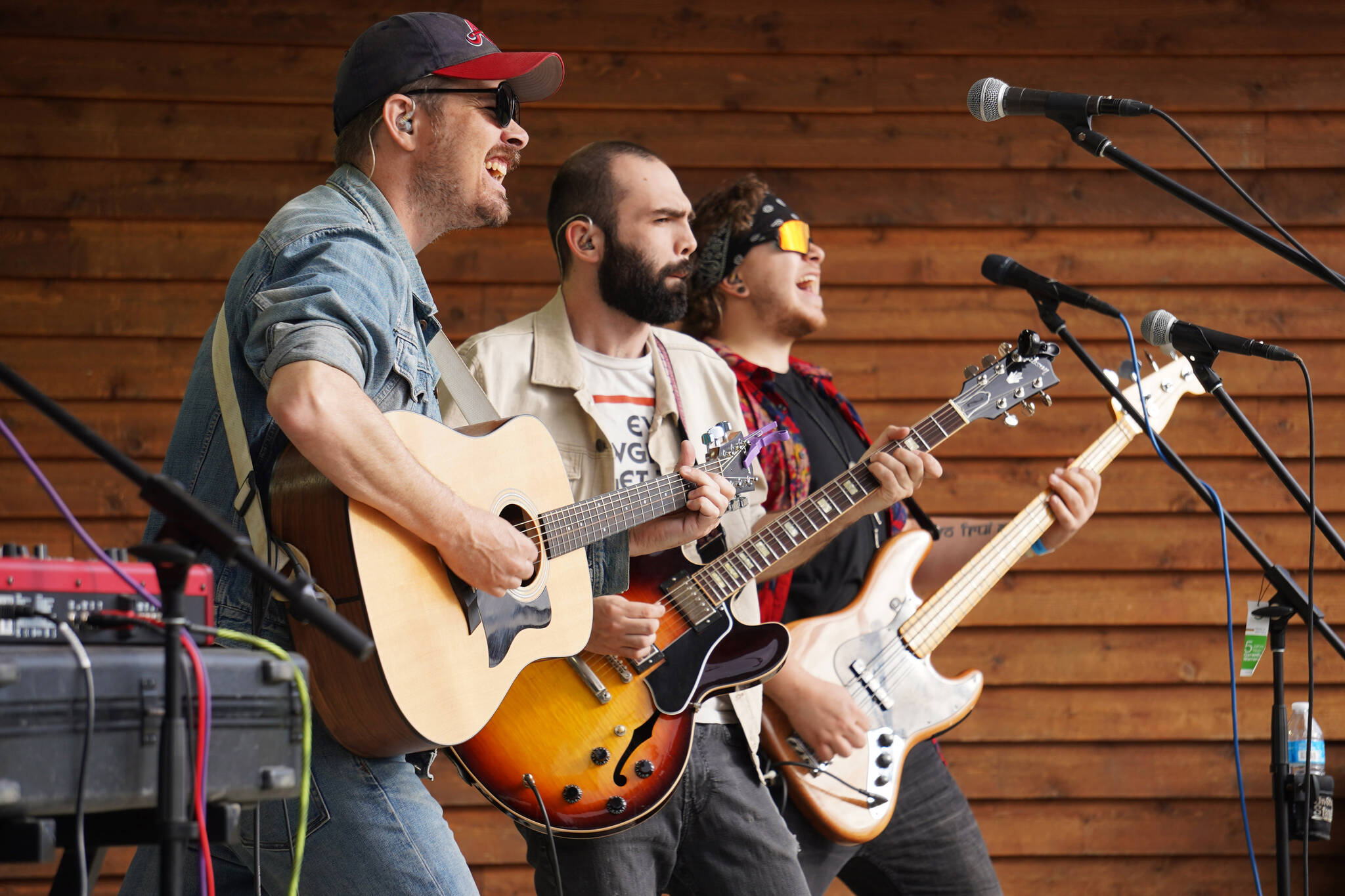 Blackwater Railroad Company’s Tyson Davis, Matt Faubion and Ben Sayers perform during the Levitt AMP Soldotna Music Series on Wednesday, June 7, 2023, at Soldotna Creek Park in Soldotna, Alaska. (Jake Dye/Peninsula Clarion)