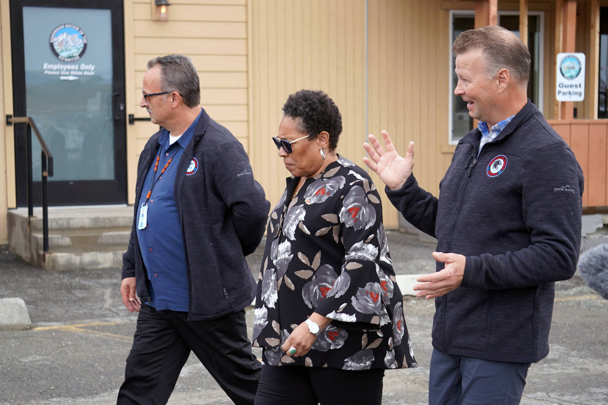 U.S. Department of Housing and Urban Development Secretary Marcia L. Fudge, center, is joined by Kenaitze/Salamatof Tribally Designated Housing Entity Housing and Facilities Director Dale Segura and Chair Kaarlo Wik on a tour of the Kahtnuht’ana Qayeh in Kenai, Alaska, on Wednesday, Aug. 30, 2023. (Jake Dye/Peninsula Clarion)