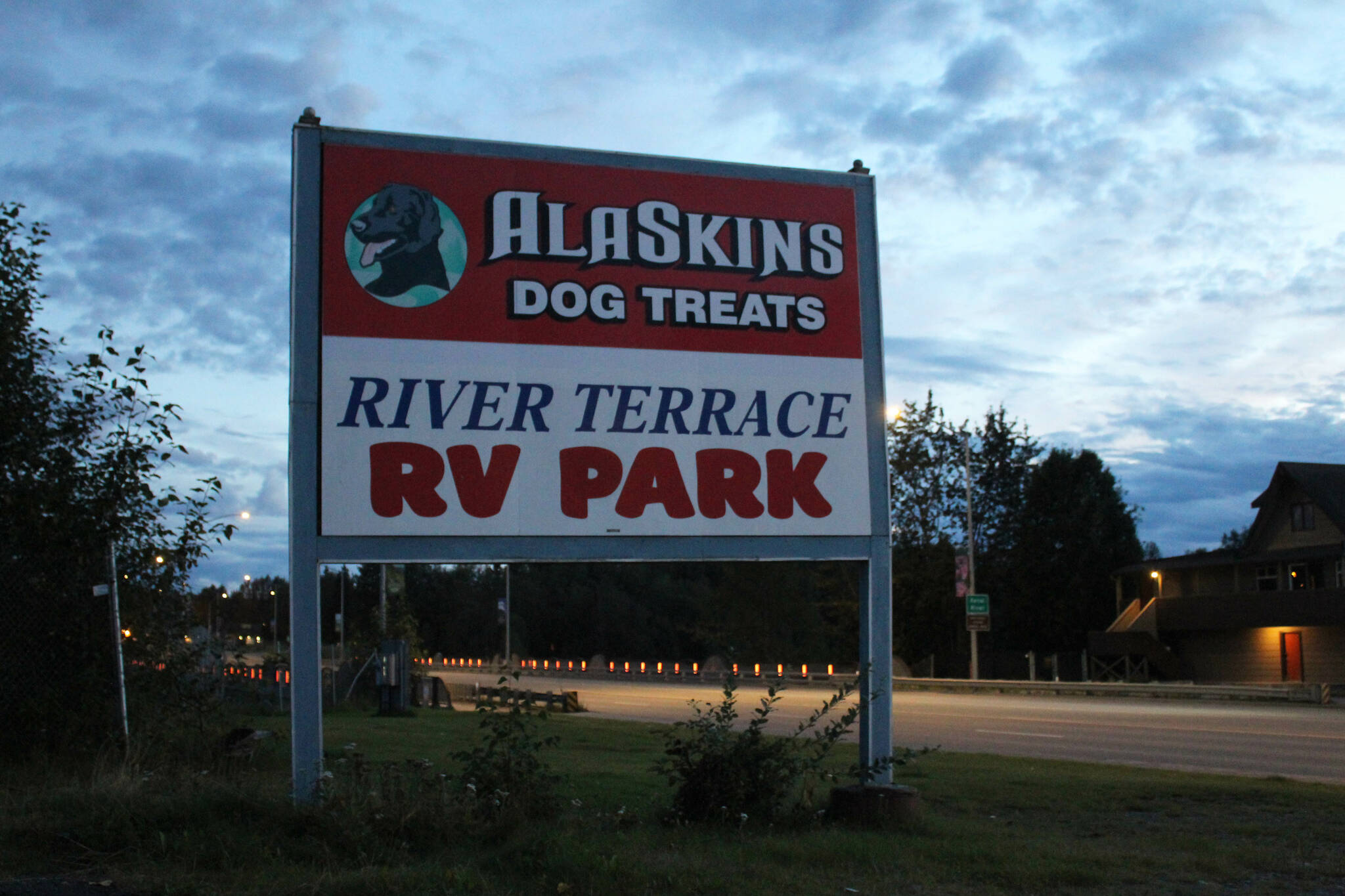 A sign welcomes visitors to AlaSkins and the River Terrace RV Park on Wednesday, Aug. 30, 2023, in Soldotna, Alaska. (Ashlyn O’Hara/Peninsula Clarion)