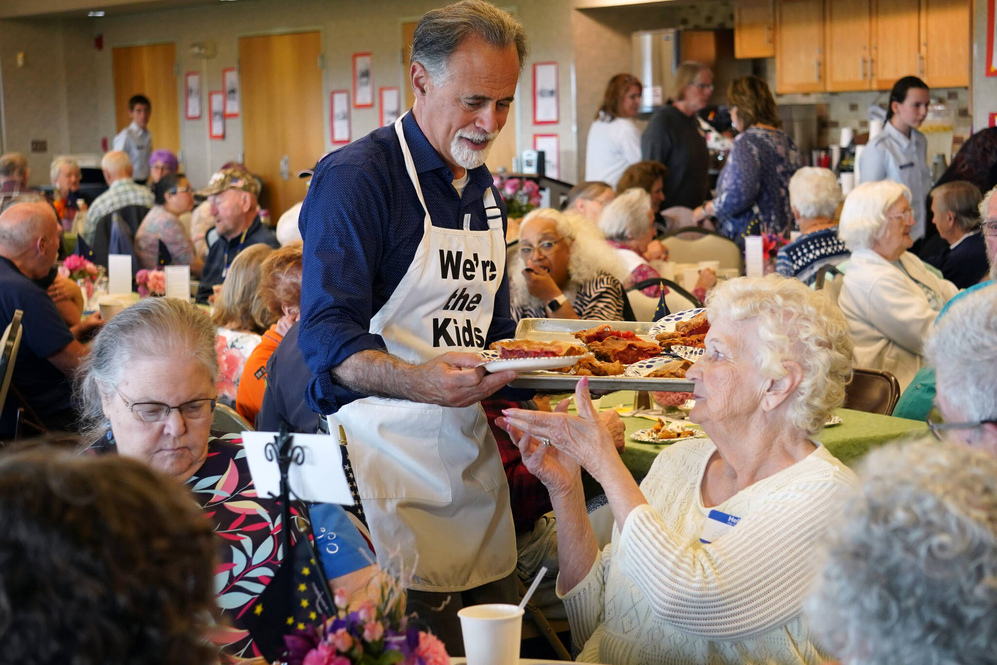 One of “The Kids,” Kenai Peninsula Borough Mayor Peter Micciche, serves pie to attendees of the Old Timer’s Luncheon at the Kenai Senior Center in Kenai, Alaska, on Thursday, Aug. 31, 2023. (Jake Dye/Peninsula Clarion)