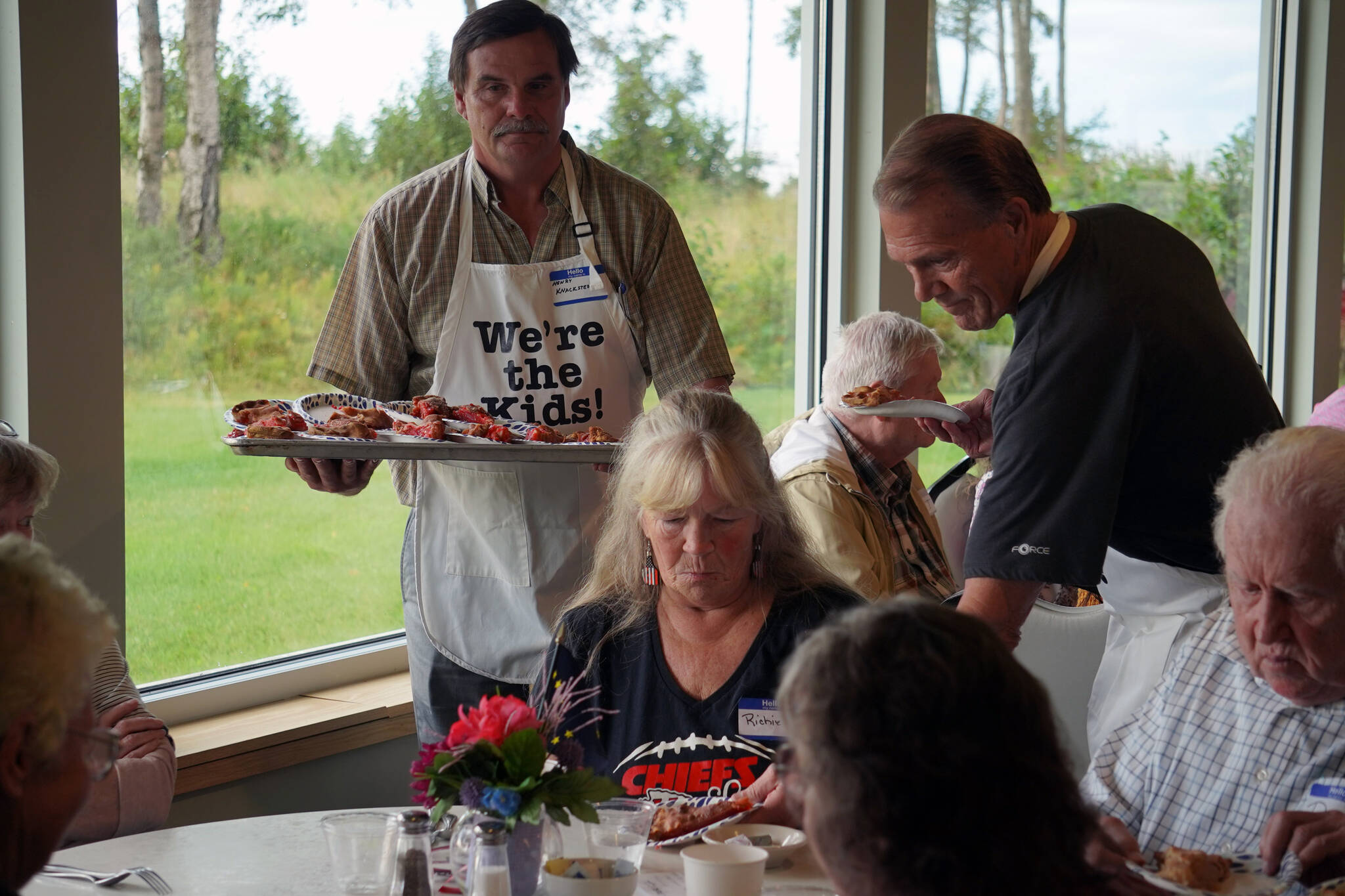 “The Kids” serve pie to attendees of the Old Timer’s Luncheon at the Kenai Senior Center in Kenai, Alaska, on Thursday, Aug. 31, 2023. (Jake Dye/Peninsula Clarion)