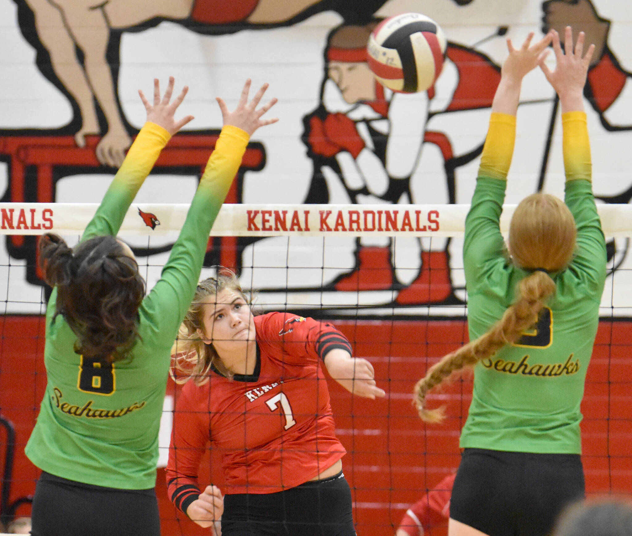 Kenai Central’s Emma Beck attacks against Seward’s Mikinley Williams and Robin Cronin on Tuesday, Sept. 5, 2023, at Kenai Central High School in Kenai, Alaska. (Photo by Jeff Helminiak/Peninsula Clarion)