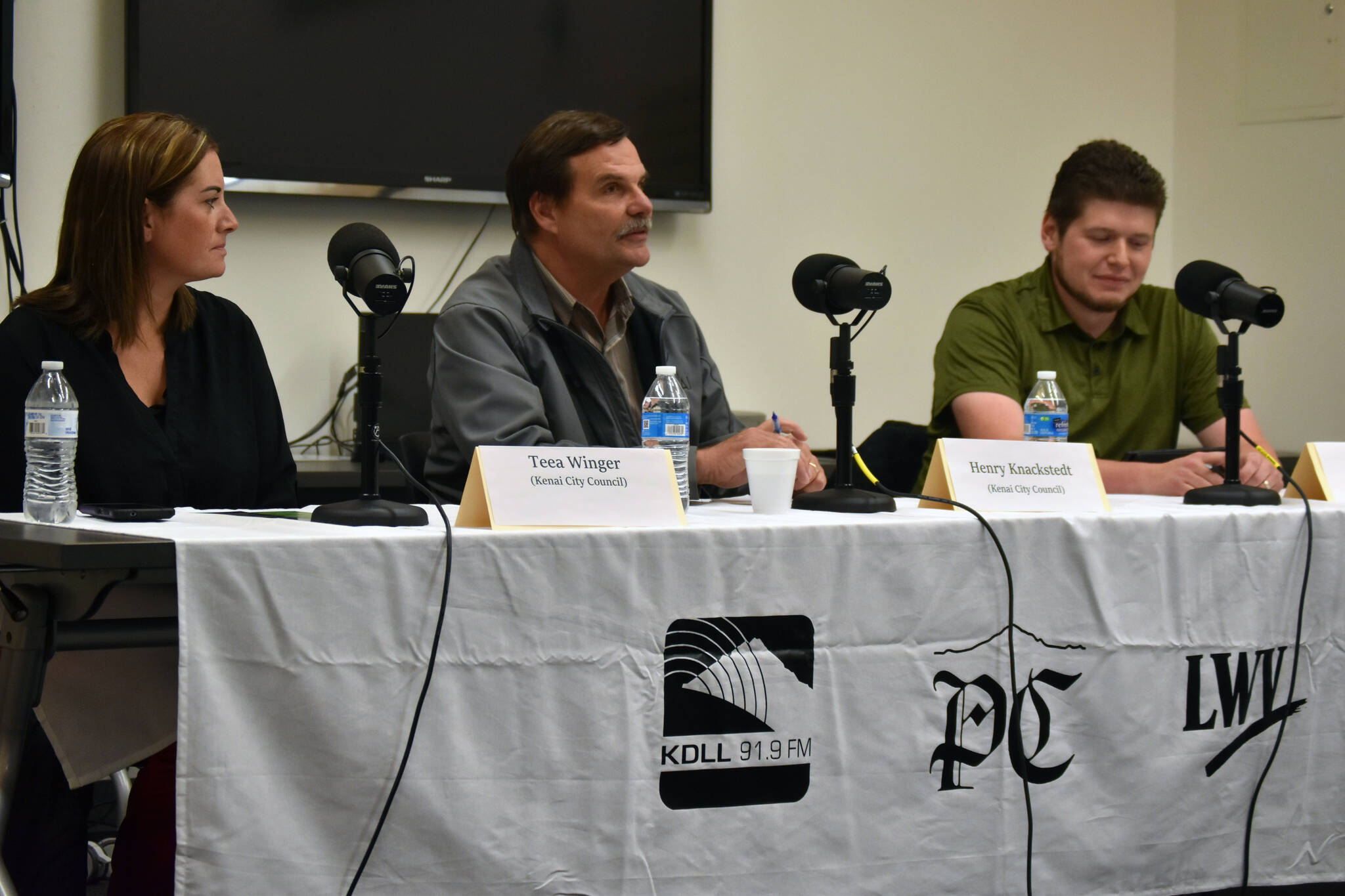 Teea Winger, Henry Knackstedt and Phil Daniel participate in a Kenai City Council candidate forum at the Kenai Community Library in Kenai, Alaska, on Thursday, Sept. 7, 2023. (Jake Dye/Peninsula Clarion)