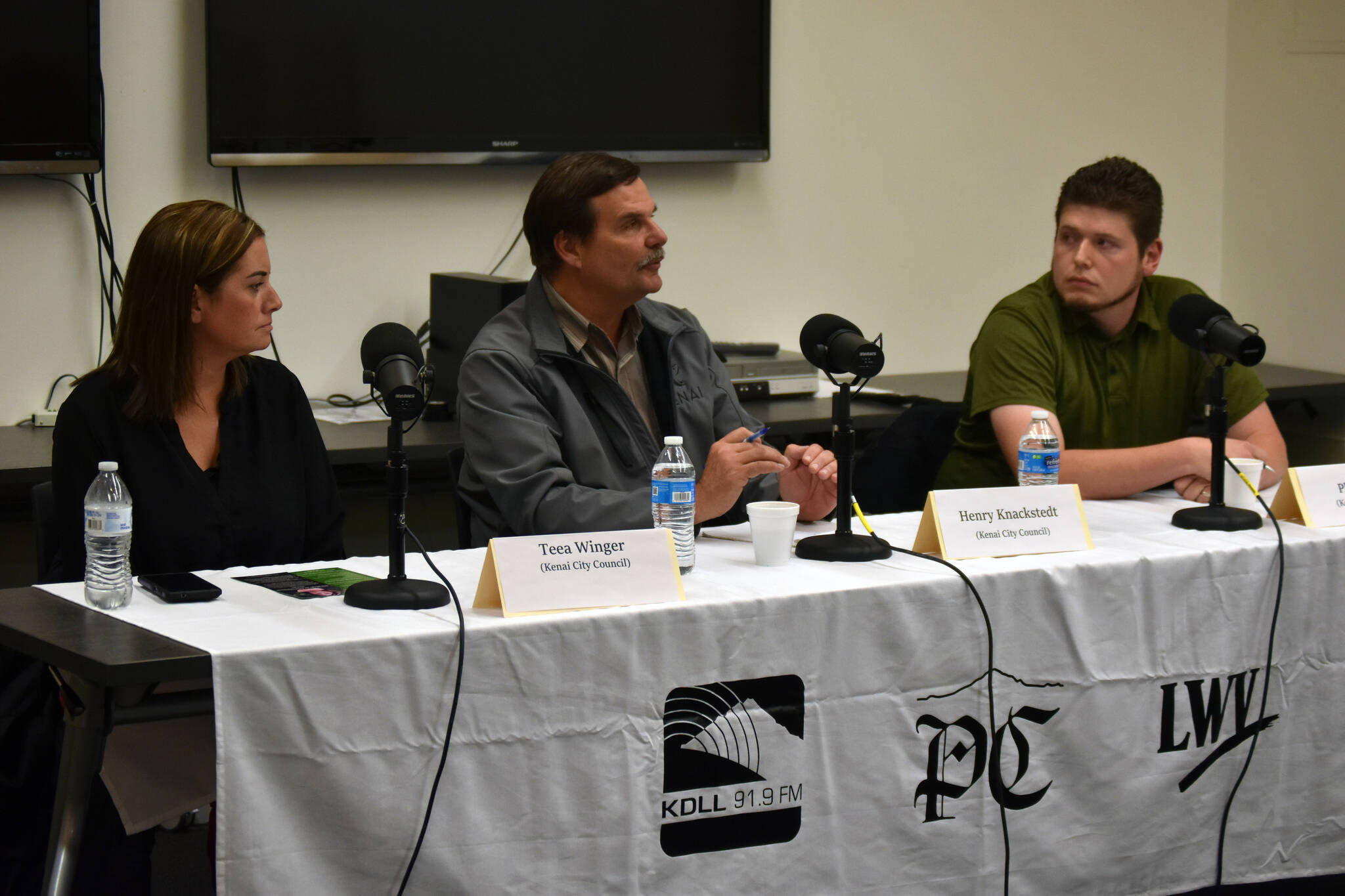 Teea Winger, Henry Knackstedt and Phil Daniel participate in a Kenai City Council candidate forum at the Kenai Community Library in Kenai, Alaska, on Thursday, Sept. 7, 2023. (Jake Dye/Peninsula Clarion)