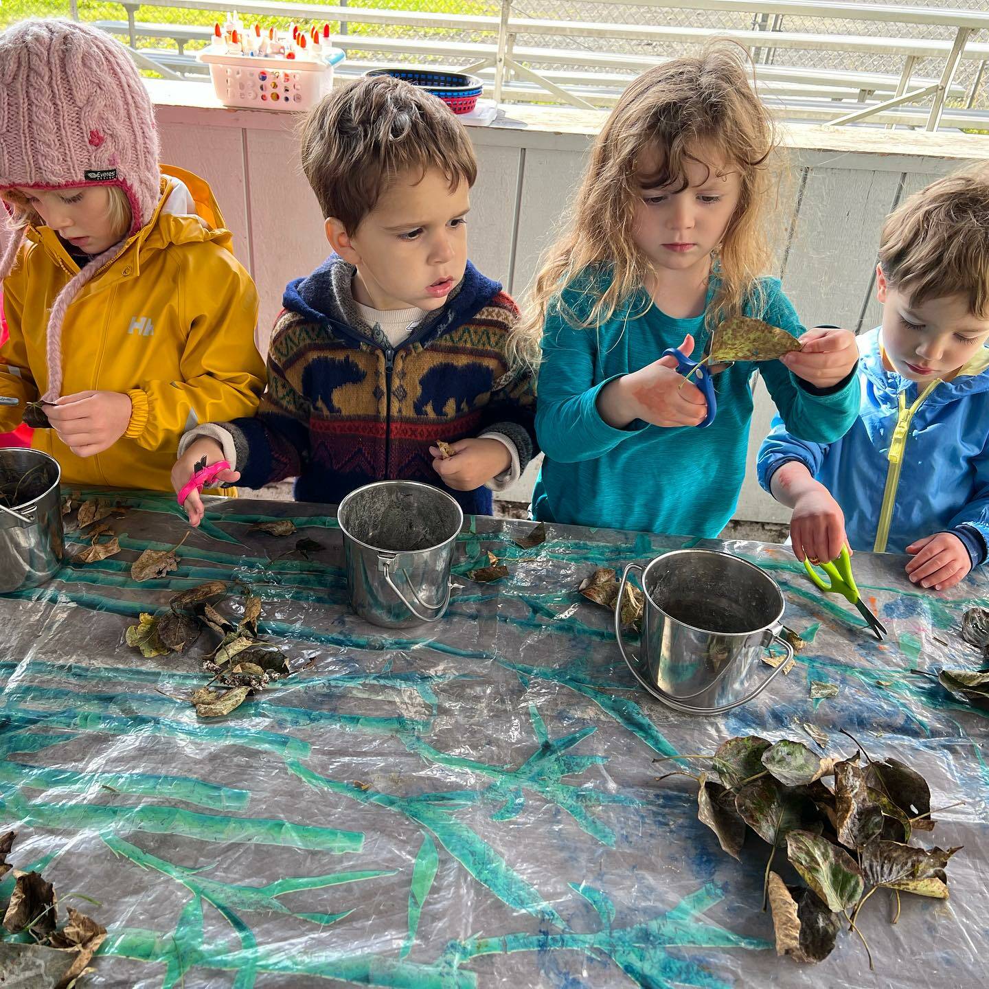 Students attending Sprouts Preschool make magic wands out of leaves in Seward, Alaska. (Photo courtesy Seward Sprouts Preschool)