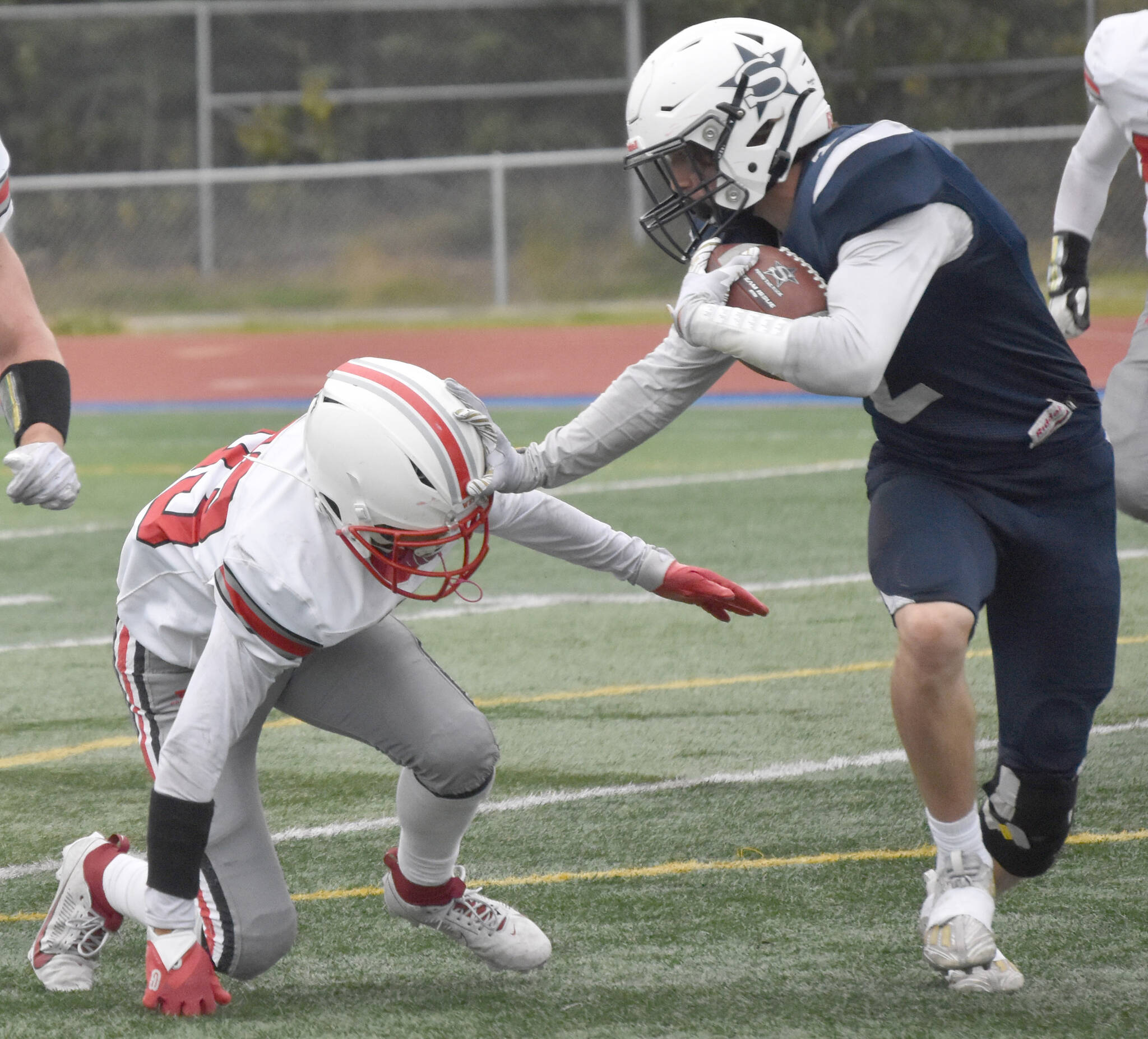 Soldotna’s Leigh Tacey tries to avoid Wasilla’s Kemeul Rodriguez on Friday, Sept. 8, 2023, at Justin Maile Field at Soldotna High School in Soldotna, Alaska. (Photo by Jeff Helminiak/Peninsula Clarion)