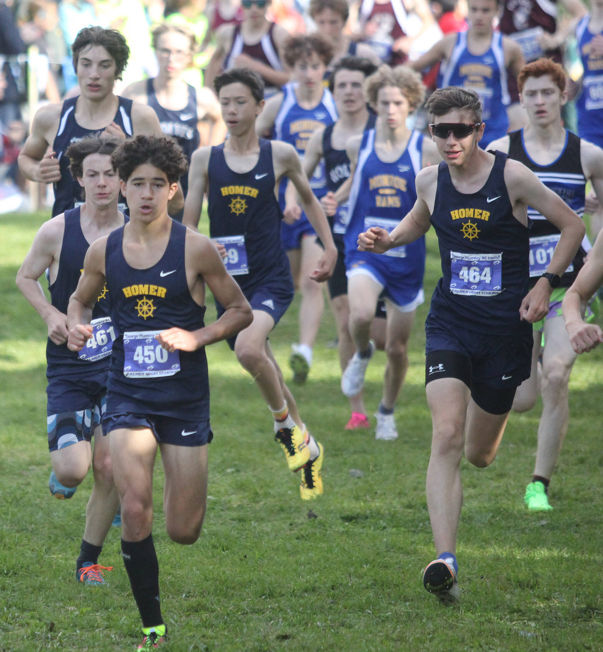 A group of Homer athletes run to the front of the pack early during the boys varsity race of the George Plumley XC Invite on Saturday, Sept. 9, 2023, at Palmer High School in Palmer, Alaska. (Photo by Jeremiah Bartz/Frontiersman)
