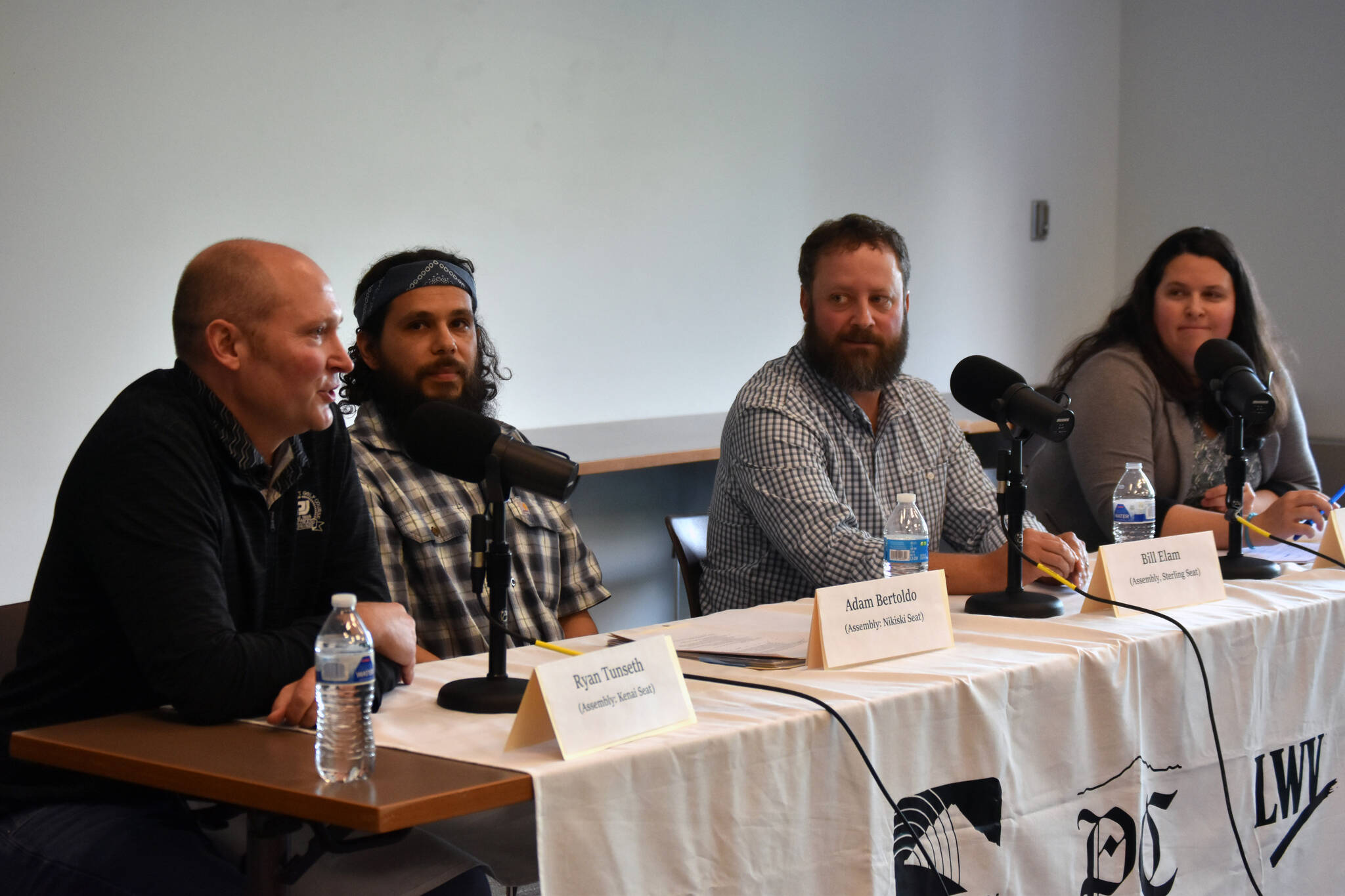 Ryan Tunseth, Adam Bertoldo, Bill Elam and Nissa Savage participate in a Kenai Peninsula Borough Assembly candidate forum at Soldotna Public Library in Soldotna, Alaska, on Monday, Sept. 11, 2023. (Jake Dye/Peninsula Clarion)