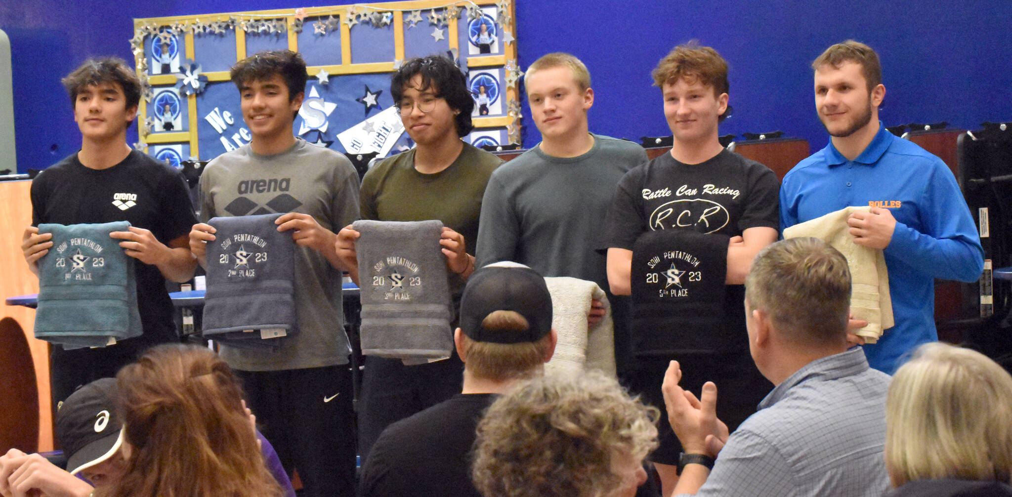 The top six boys finishers in the SoHi Pentathlon pose with their trophy towels on Friday, Sept. 15, 2023, at Soldotna High School in Soldotna, Alaska. From left to right are Seward’s Nickolas Ambrosiani in first, Seward’s Bengimin Ambrosiani in second, Kodiak’s James Berestoff in third, Colony’s Isaiah Hulien in fourth, Palmer’s Aidan Houser in fifth and Soldotna’s Nikita Monyahan in sixth. (Photo by Jeff Helminiak/Peninsula Clarion)