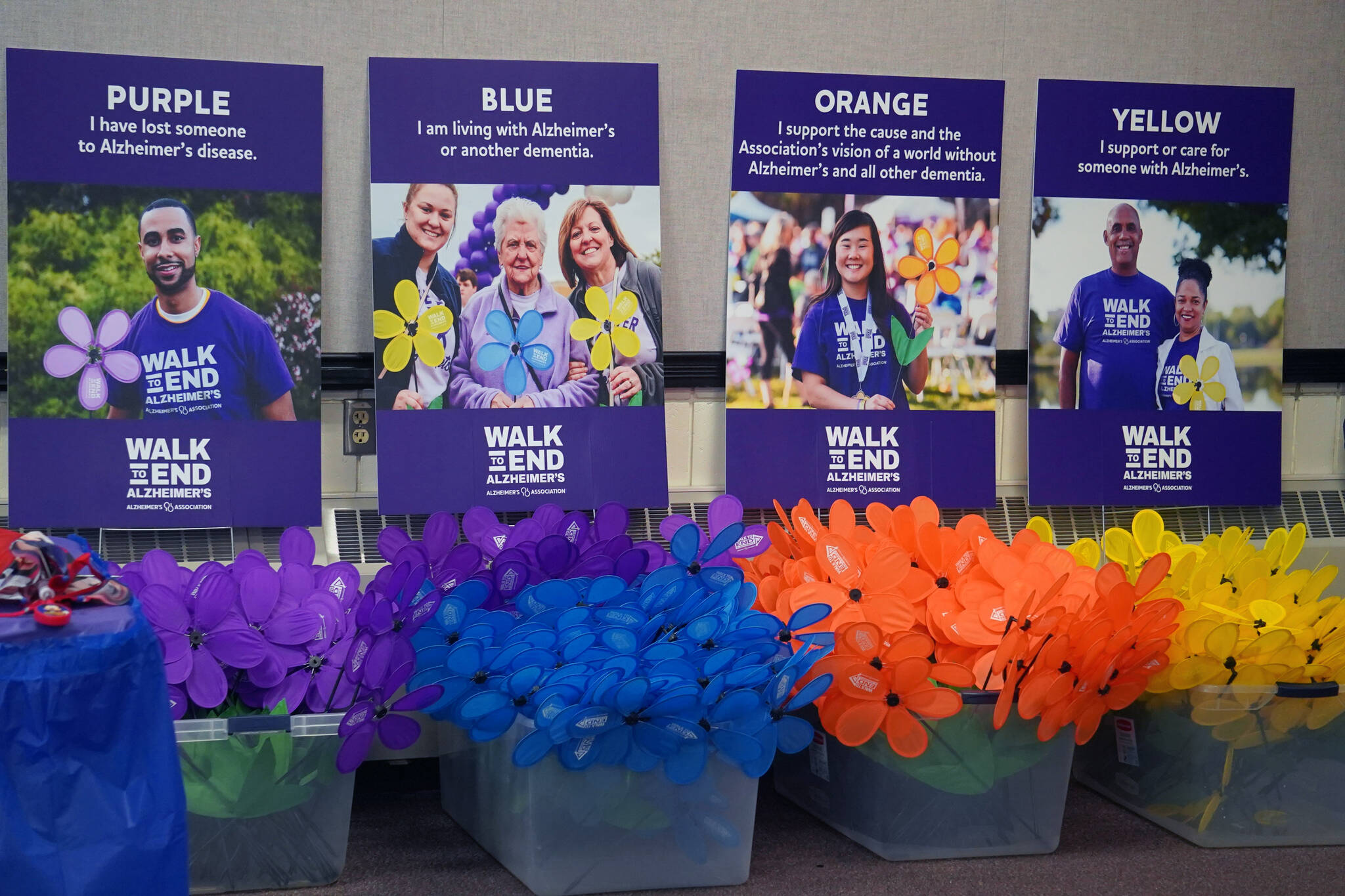 Totes filled with promise garden flowers for the Walk to End Alzheimers are seen at the Soldotna Regional Sports Complex in Soldotna, Alaska, on Saturday, Sept. 16, 2023. (Jake Dye/Peninsula Clarion)