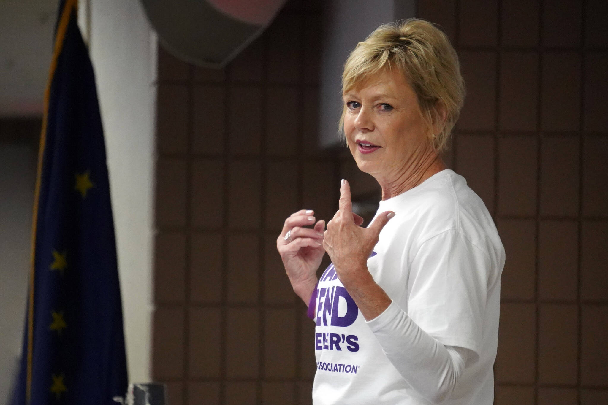 Ann Tillery leads guided yoga ahead of the Walk to End Alzheimer’s at the Soldotna Regional Sports Complex in Soldotna, Alaska, on Saturday, Sept. 16, 2023. (Jake Dye/Peninsula Clarion)