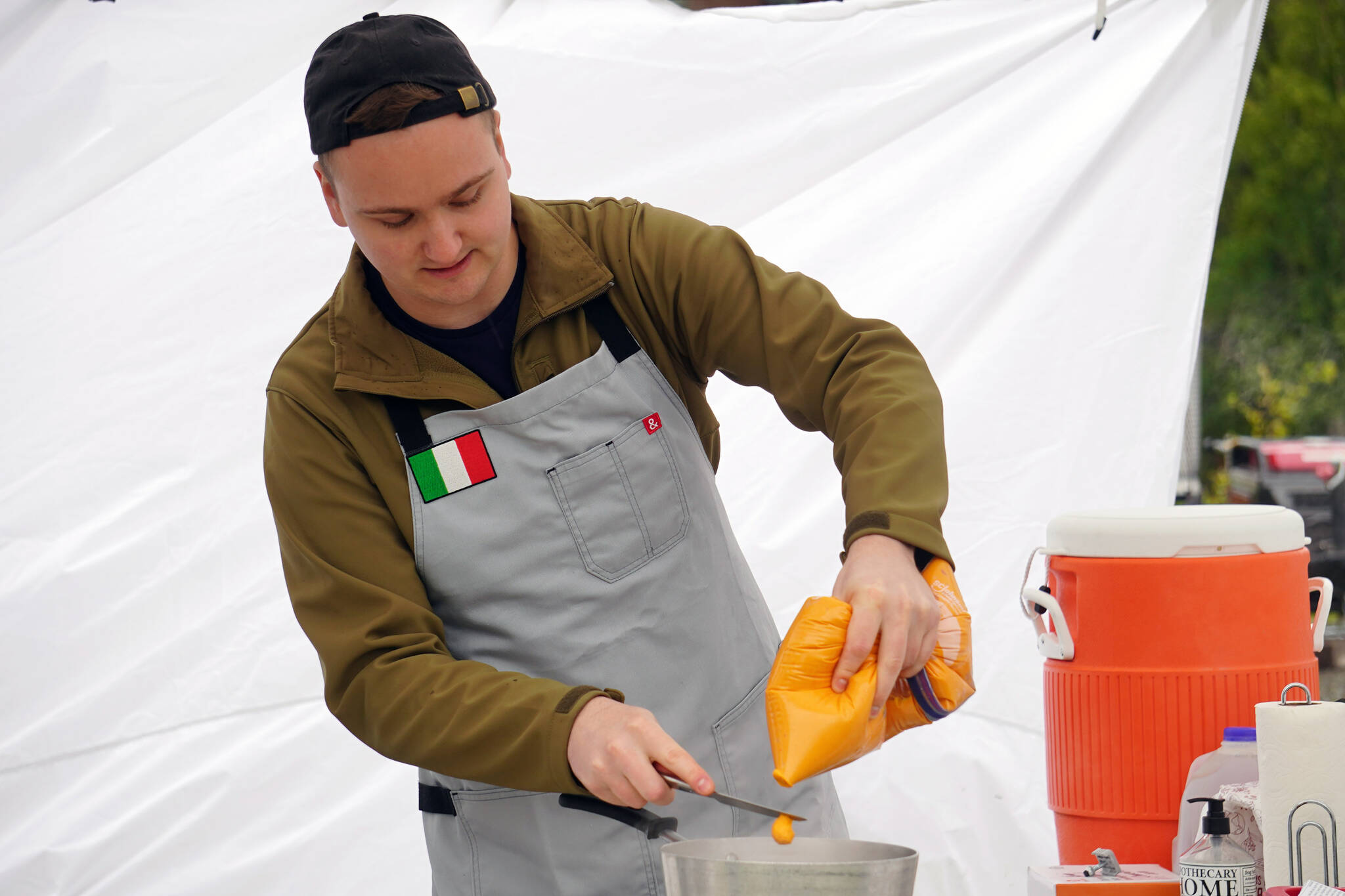 Andrew Agosti prepares carrot gnocchi at the Harvest Moon Local Food Festival’s Chef Tent at Soldotna Creek Park in Soldotna, Alaska, on Saturday, Sept. 16, 2023. (Jake Dye/Peninsula Clarion)