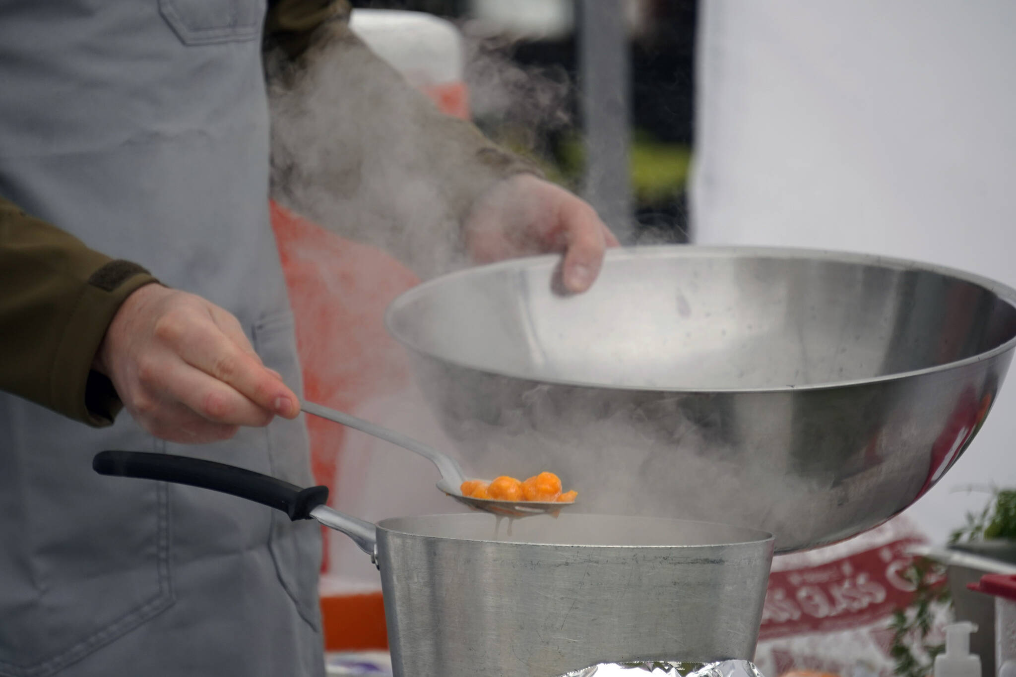 Andrew Agosti prepares carrot gnocchi at the Harvest Moon Local Food Festival’s Chef Tent at Soldotna Creek Park in Soldotna, Alaska, on Saturday, Sept. 16, 2023. (Jake Dye/Peninsula Clarion)