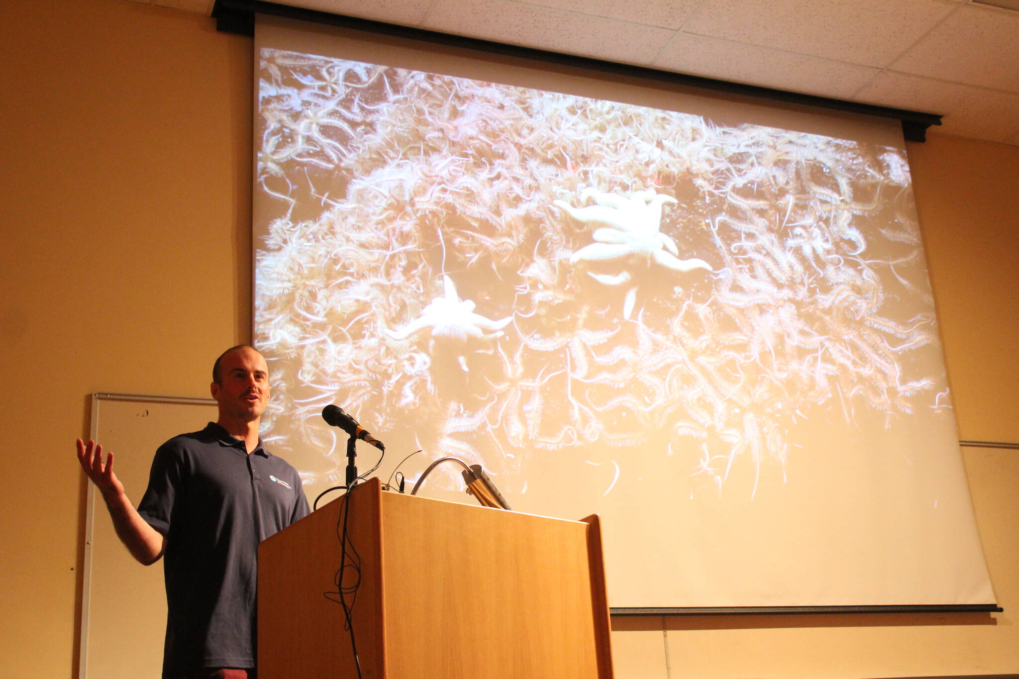 NOAA’s Sam Candio talks about research conducted aboard the Okeanos Explorer in Alaska this year during the inaugural Seward Marine Science Symposium on Sunday, Sept. 17, 2023, in Seward, Alaska. (Ashlyn O’Hara/Peninsula Clarion)