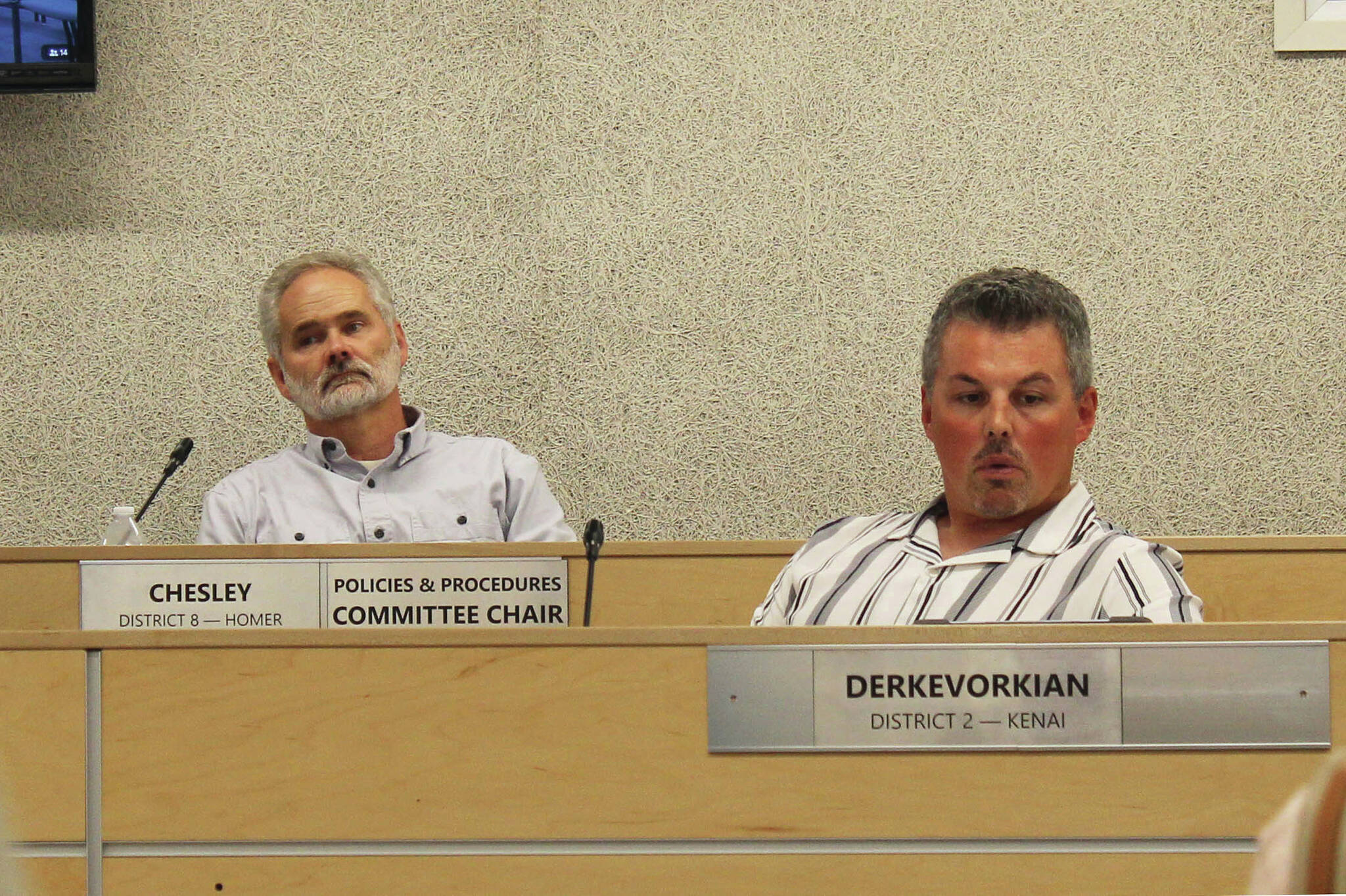 Assembly members Lane Chesley, left, and Richard Derkevorkian participate in a borough assembly meeting on Tuesday, Aug. 1, 2023, in Soldotna, Alaska. (Ashlyn O’Haara/Peninsula Clarion)