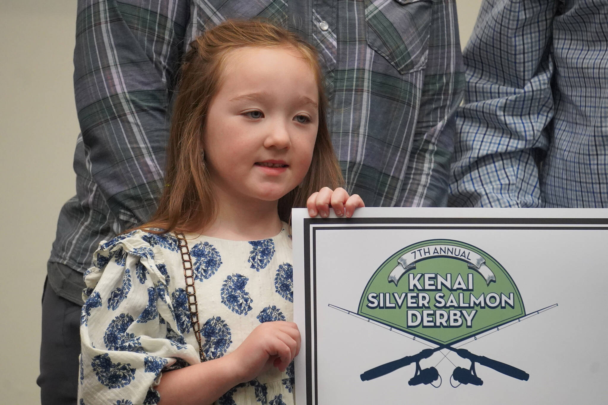 Abigal Craig, youth winner of the Seventh Annual Kenai Silver Salmon Derby, is presented a novelty check at the Kenai Chamber of Commerce and Visitor Center in Kenai, Alaska, on Wednesday, Sept. 20, 2023. (Jake Dye/Peninsula Clarion)