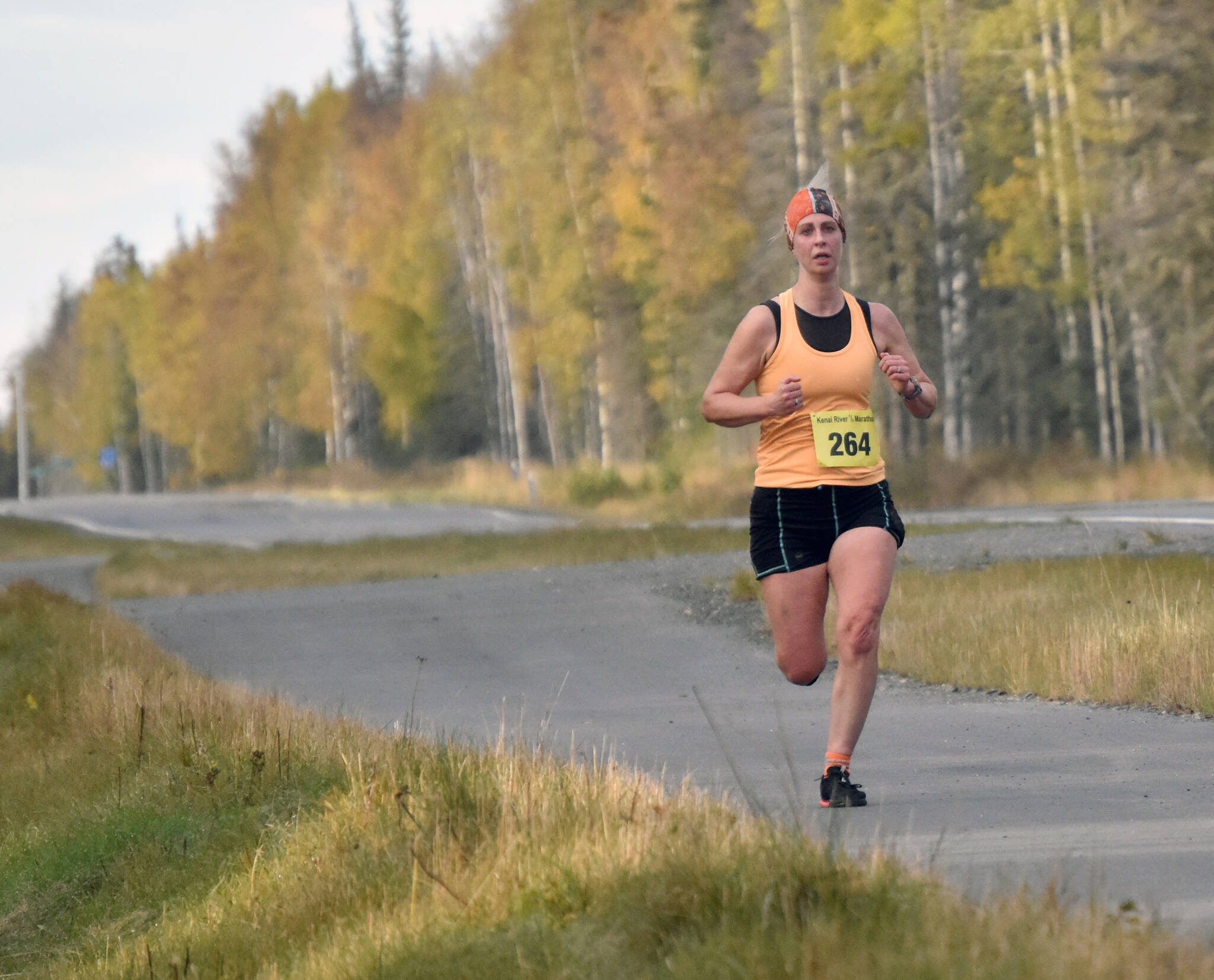 Elizabeth Roedl of Homer runs in the women’s half marathon at the Kenai River Marathon on Sunday, Sept. 24, 2023, in Kenai, Alaska. Roedl finished second. (Photo by Jeff Helminiak/Peninsula Clarion)