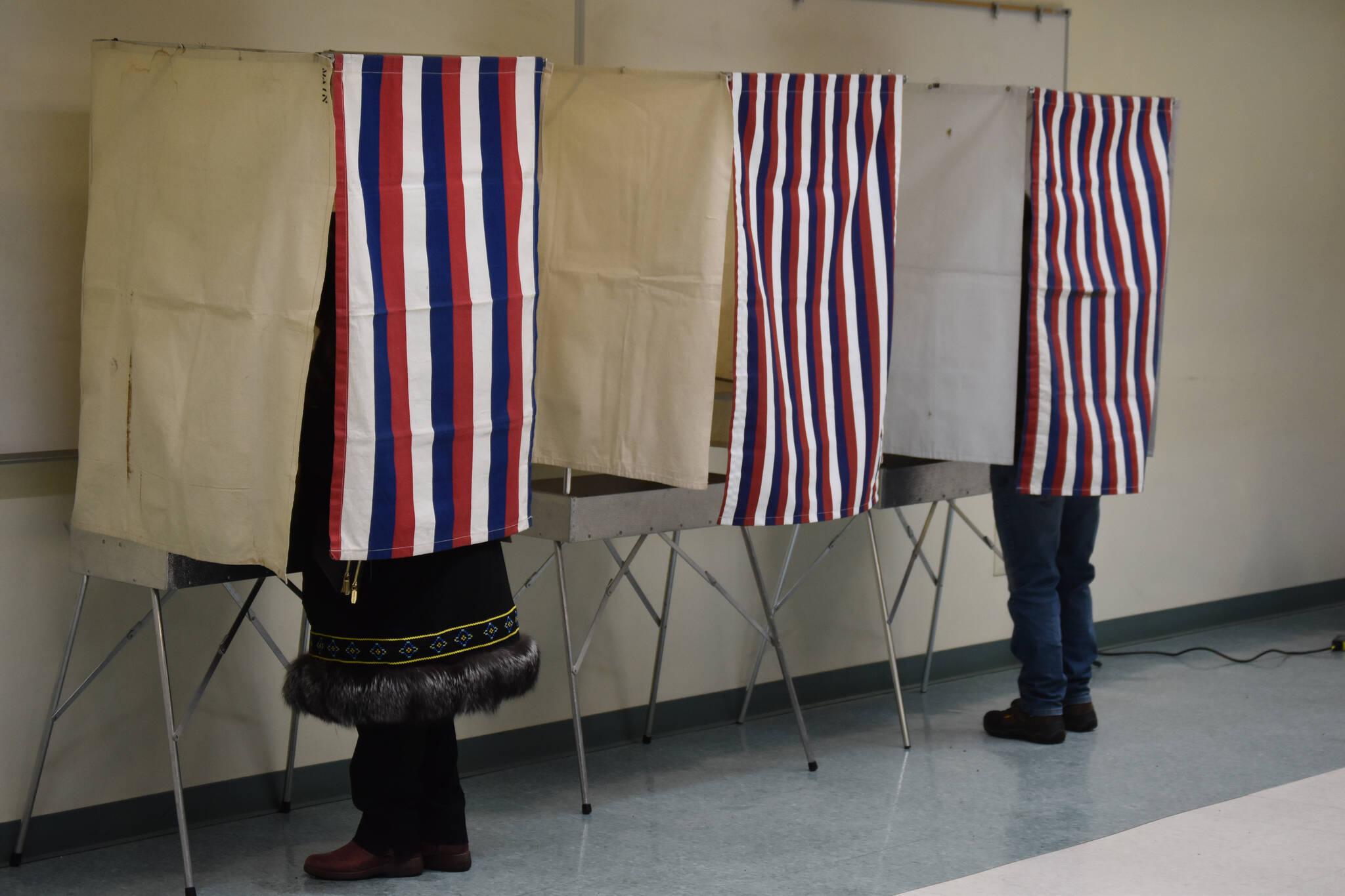 Voters fill out their ballots at the Challenger Learning Center in Kenai, Alaska, on Election Day, Nov. 8, 2022. (Jake Dye/Peninsula Clarion)