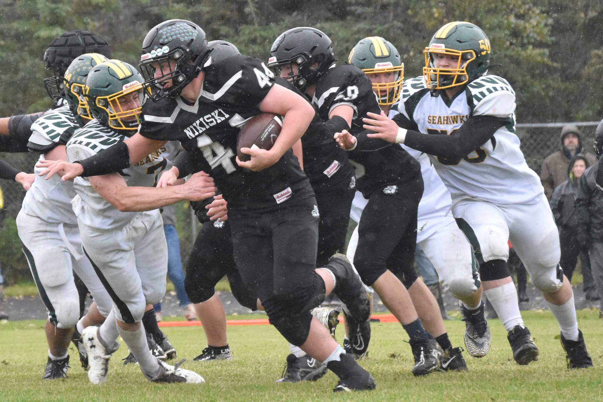 Nikiski's Truit McCaughey tries to break the tackle of Seward's Judah Brueckner on Saturday, Sept. 16, 2023, at Nikiski Middle-High School in Nikiski, Alaska. (Photo by Jeff Helminiak/Peninsula Clarion)