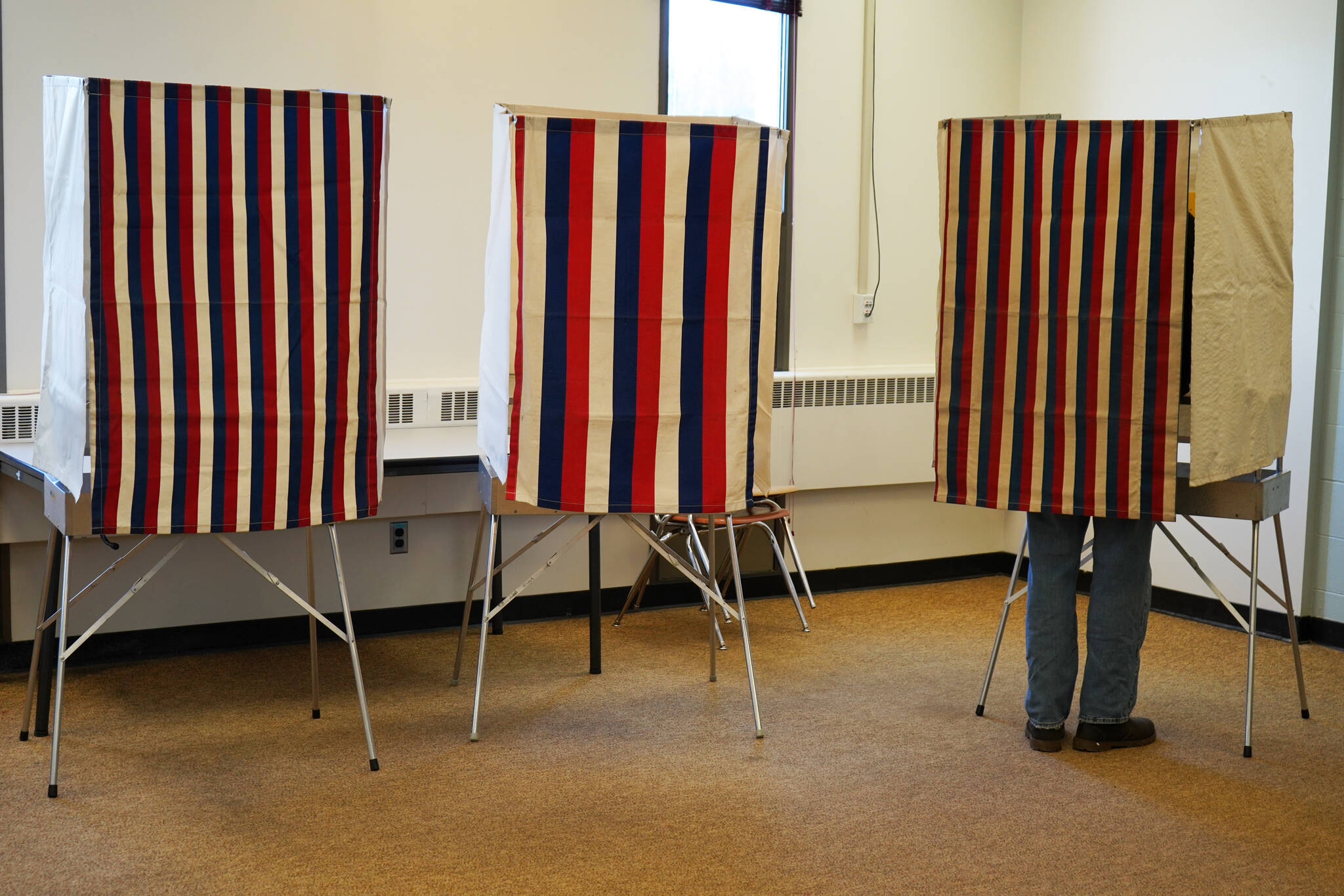 A lone voter fills in their ballot at Soldotna Prep School in Soldotna, Alaska, during election day on Tuesday, Oct. 3, 2023. (Jake Dye/Peninsula Clarion)