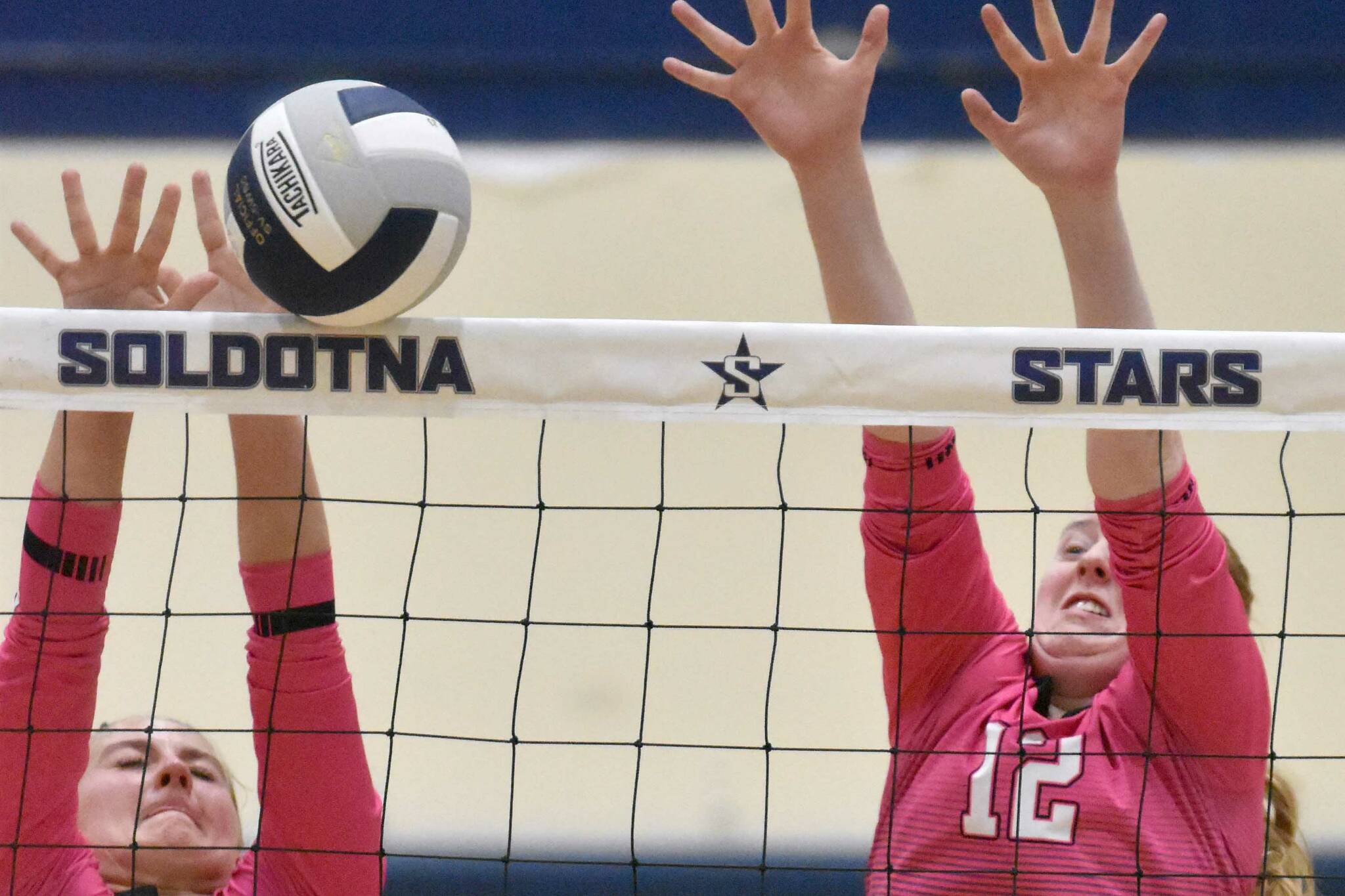 Kenai Central's Kate Wisnewski and Ellsi Miller put up a block against Soldotna on Tuesday, Oct. 3, 2023, at Soldotna High School in Soldotna, Alaska. (Photo by Jeff Helminiak/Peninsula Clarion)