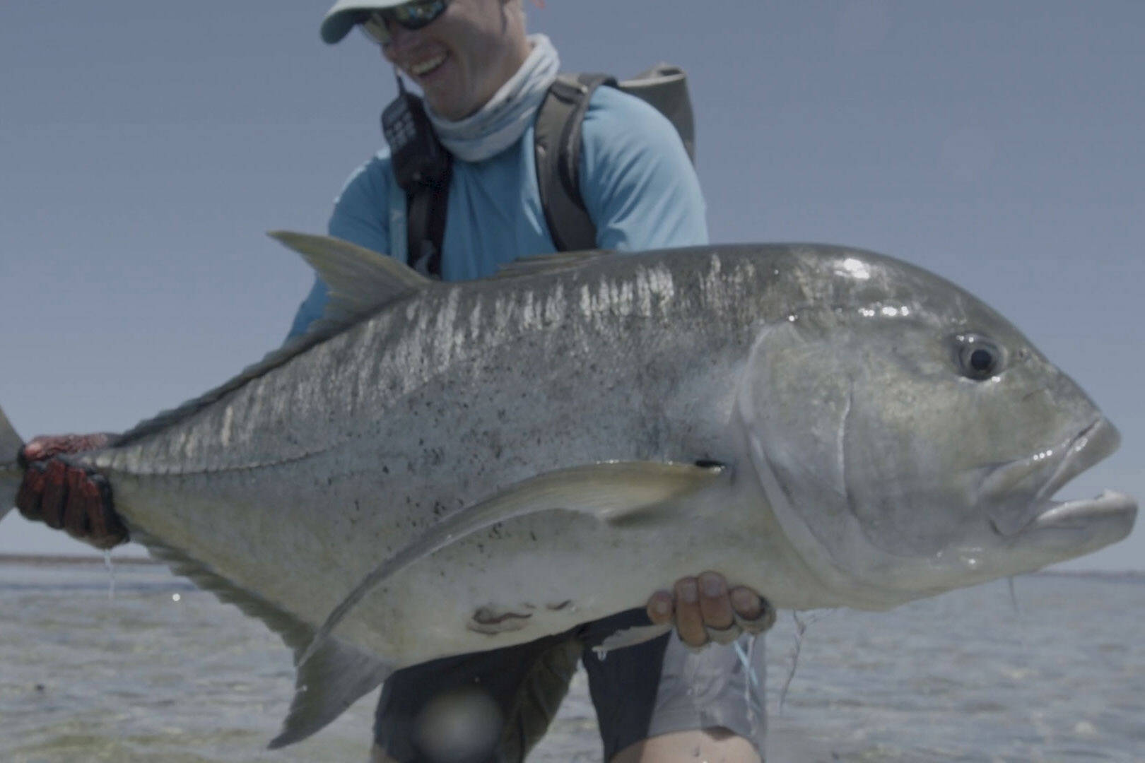 An angler holds up a massive fish in “Jacks: A Film by Jako Lucas & Ra Beattie.” (Photo courtesy International Fly Fishing Festival)