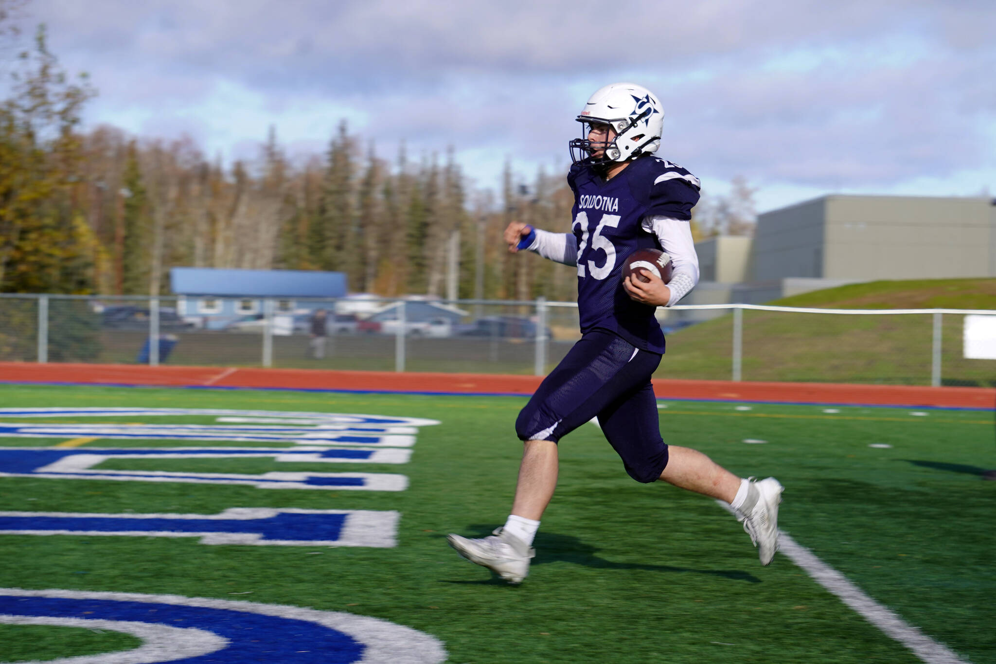 Soldotna’s Gehret Medcoff lands a touchdown during a Division II playoff game at Justin Maile Field in Soldotna, Alaska, on Saturday, Oct. 7, 2023. (Jake Dye/Peninsula Clarion)