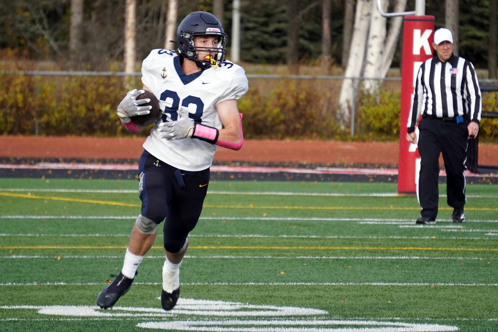 Homer’s Jake Tappan runs with the ball during a Division III playoff game at Justin Maile Field in Soldotna, Alaska, on Saturday, Oct. 7, 2023. (Jake Dye/Peninsula Clarion)