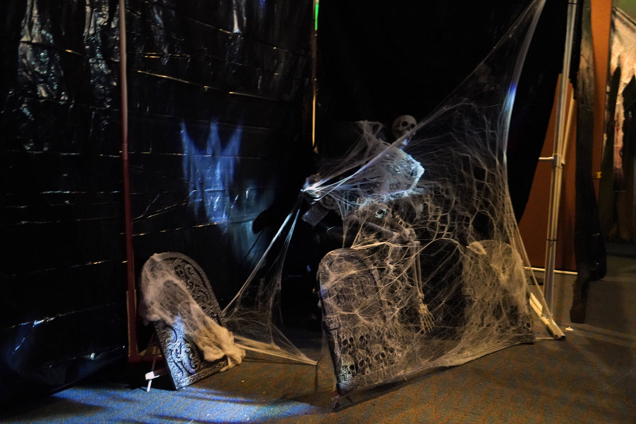 Halloween lights and iconography decorate the corridors of the Haunted Chamber at the Kenai Chamber of Commerce in Kenai, Alaska, on Monday, Oct. 9, 2023. (Jake Dye/Peninsula Clarion)