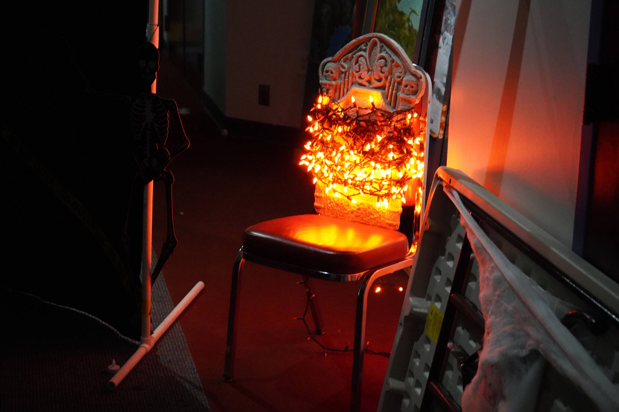 Halloween lights and iconography decorate the corridors of the Haunted Chamber at the Kenai Chamber of Commerce in Kenai, Alaska, on Monday, Oct. 9, 2023. (Jake Dye/Peninsula Clarion)