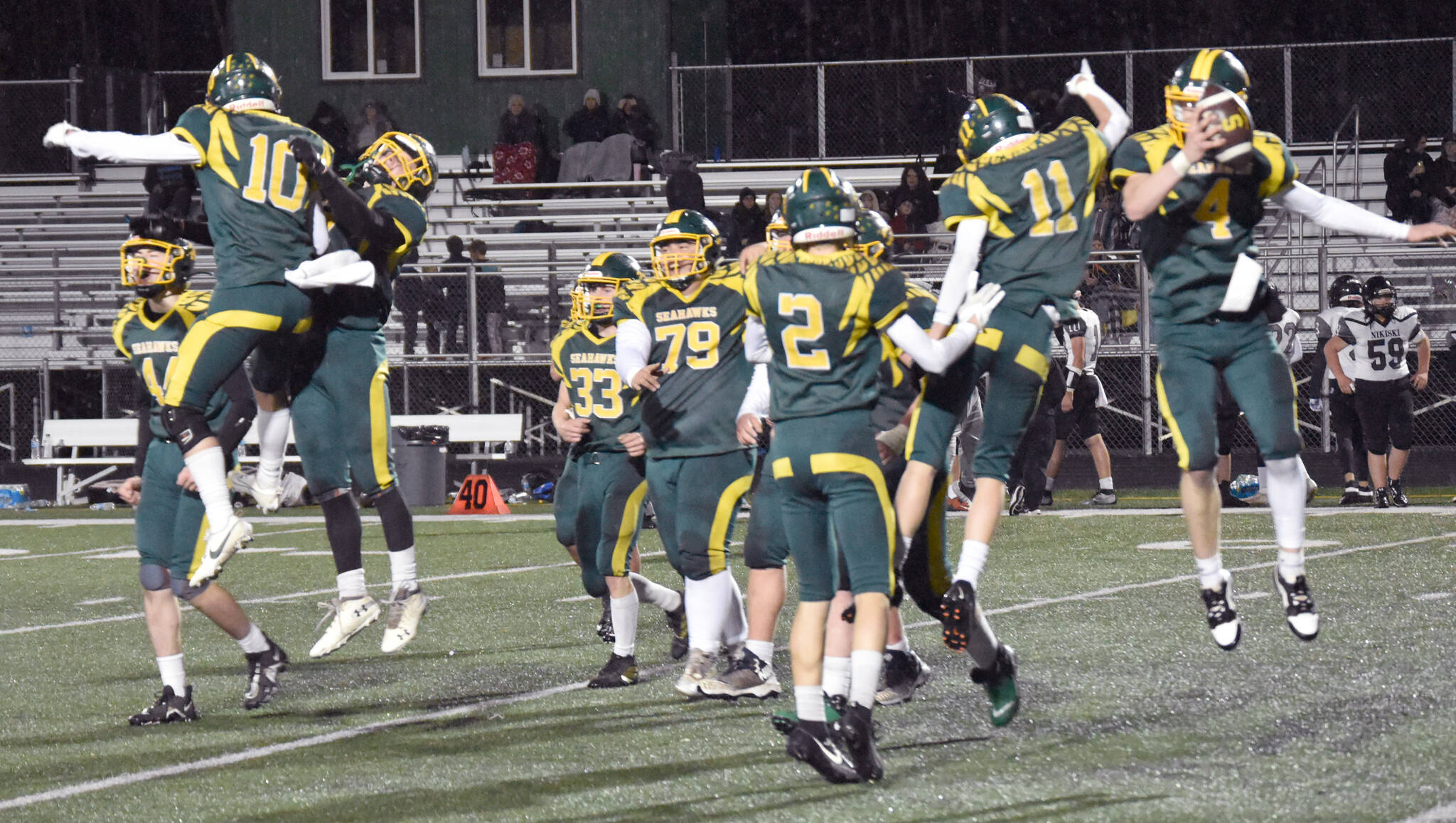 Seward celebrates defeating Nikiski on Saturday, Oct. 7, 2023, in the nine-man football state final at Colony High School in Palmer, Alaska. (Photo by Jeff Helminiak/Peninsula Clarion)